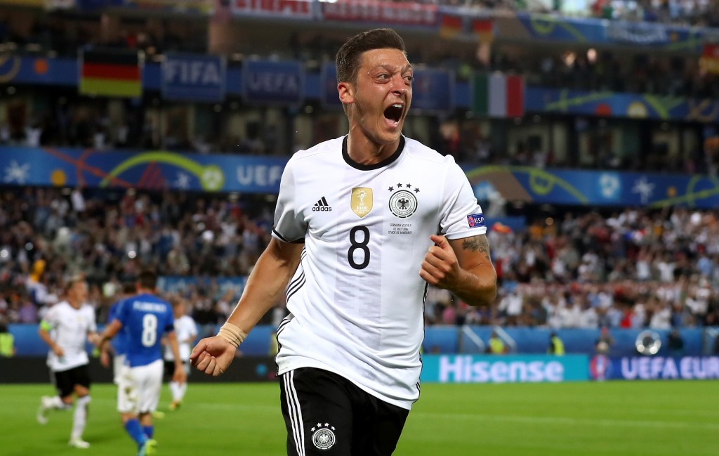 BORDEAUX, FRANCE - JULY 02: Mesut Oezil of Germany celebrates scoring the opening goal during the UEFA EURO 2016 quarter final match between Germany and Italy at Stade Matmut Atlantique on July 2, 2016 in Bordeaux, France. (Photo by Alexander Hassenstein/Getty Images)