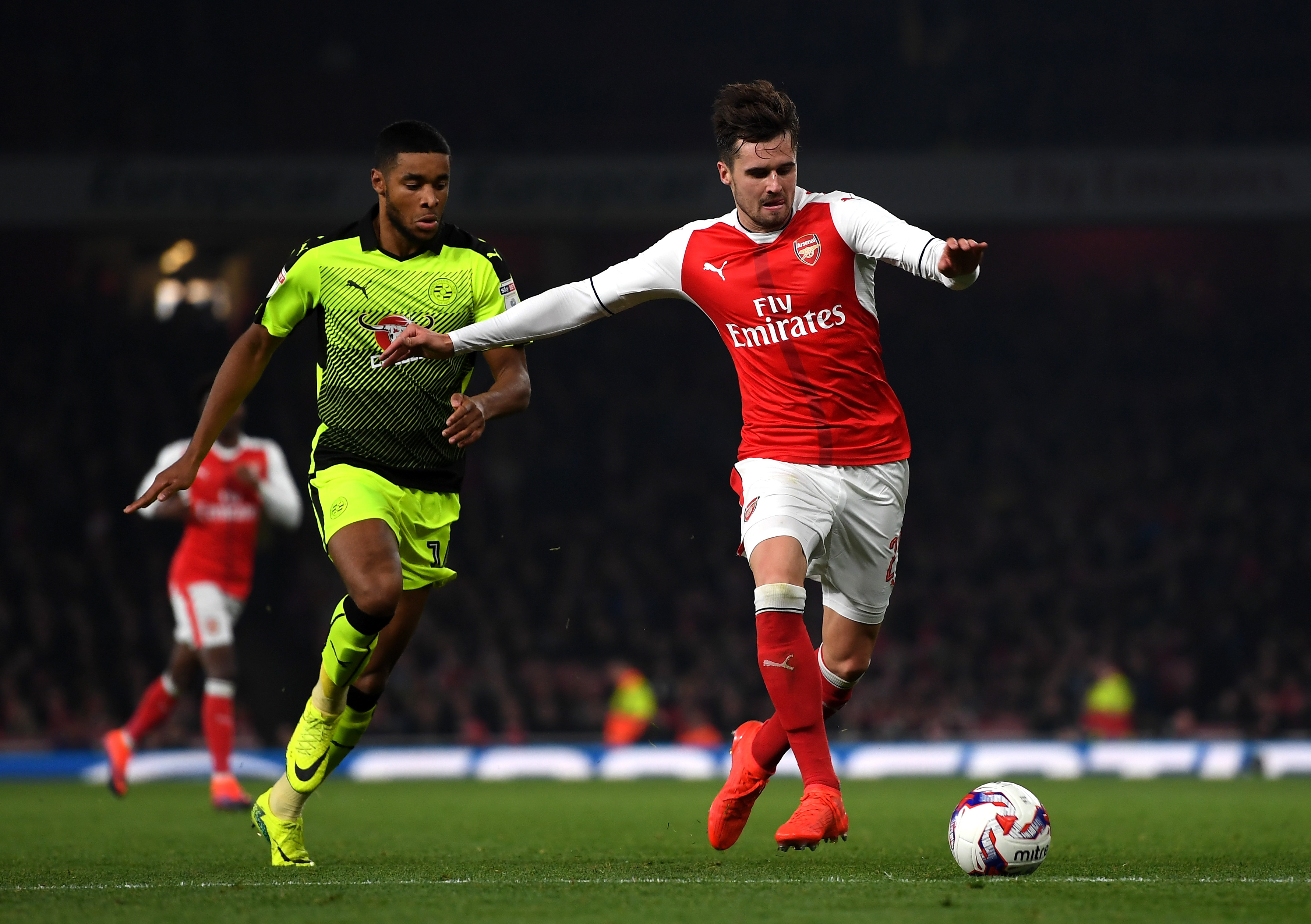 LONDON, ENGLAND - OCTOBER 25: Carl Jenkinson of Arsenal (R) is chased by Dominic Samuel of Reading (L) during the EFL Cup fourth round match between Arsenal and Reading at Emirates Stadium on October 25, 2016 in London, England. (Photo courtesy Michael Regan/Getty Images)