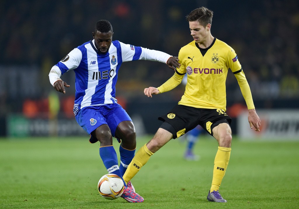 DORTMUND, GERMANY - FEBRUARY 18: Moussa Marega of FC Porto and Julian Weigl of Borussia Dortmund compete for the ball during the UEFA Europa League round of 32 first leg match between Borussia Dortmund and FC Porto at Signal Iduna Park on February 18, 2016 in Dortmund, Germany. (Photo by Dennis Grombkowski/Bongarts/Getty Images)