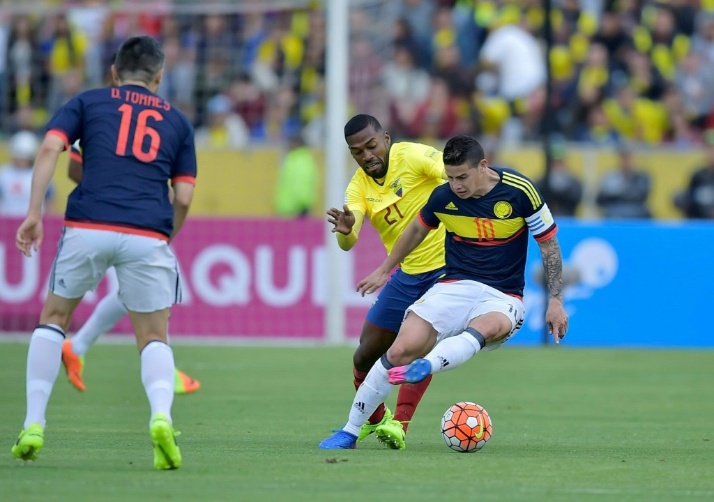 Colombia's midfielder James Rodriguez (R) vies for the ball with Ecuador's defender Gabriel Achilier during their 2018 FIFA World Cup qualifier football match in Quito, on March 28, 2017. / AFP PHOTO / Rodrigo BUENDIA (Photo credit should read RODRIGO BUENDIA/AFP/Getty Images)