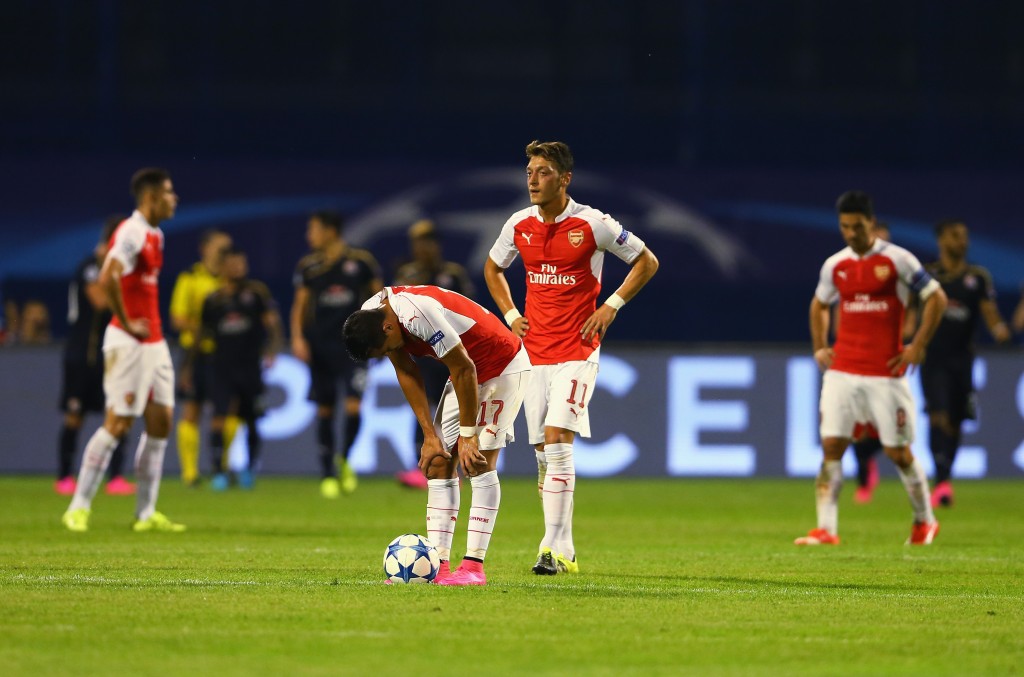 ZAGREB, CROATIA - SEPTEMBER 16: Alexis Sanchez and Mesut Oezil of Arsenal look dejected after the second Dinamo Zagreb goal during the UEFA Champions League Group F match between Dinamo Zagreb and Arsenal at Maksimir Stadium on September 16, 2015 in Zagreb, Croatia. (Photo by Alexander Hassenstein/Getty Images)