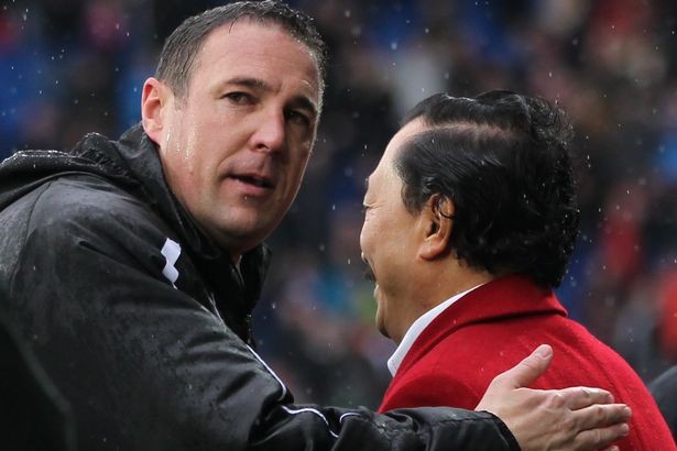 Malky Mackay (left, manager) and Vincent Tan (right, owner) of Cardiff City FC | Premier League - Liverpool On Top Ahead Of Arsenal vs Chelsea