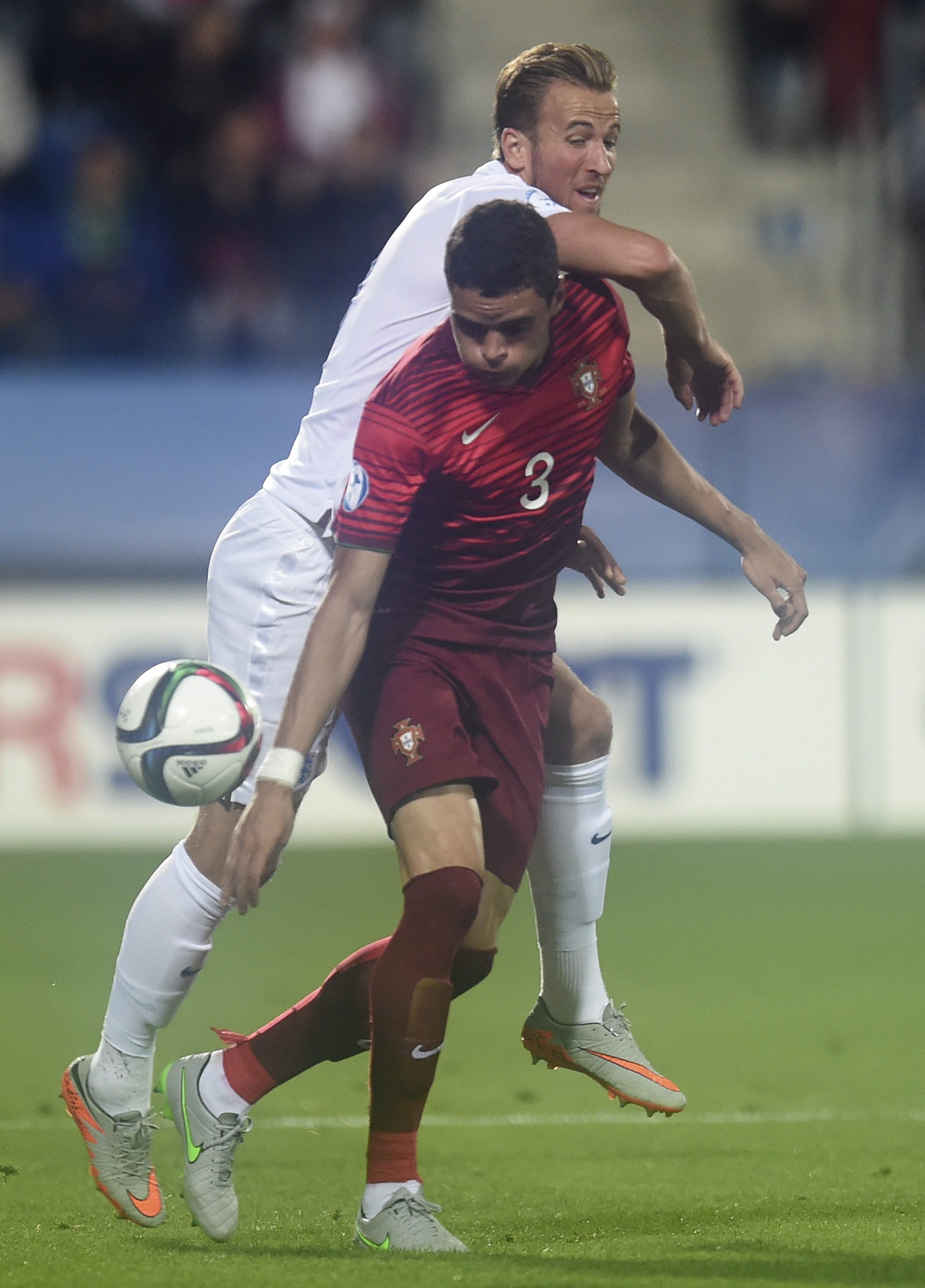English player Harry Kane (back) vies for the ball with Portuguese  player  Tiago Ilori (R) during UEFA European Under-21 soccer championship match between England and Portugal at the City Stadium in Uherske Hradiste, Czech Republic on 18 June 2015