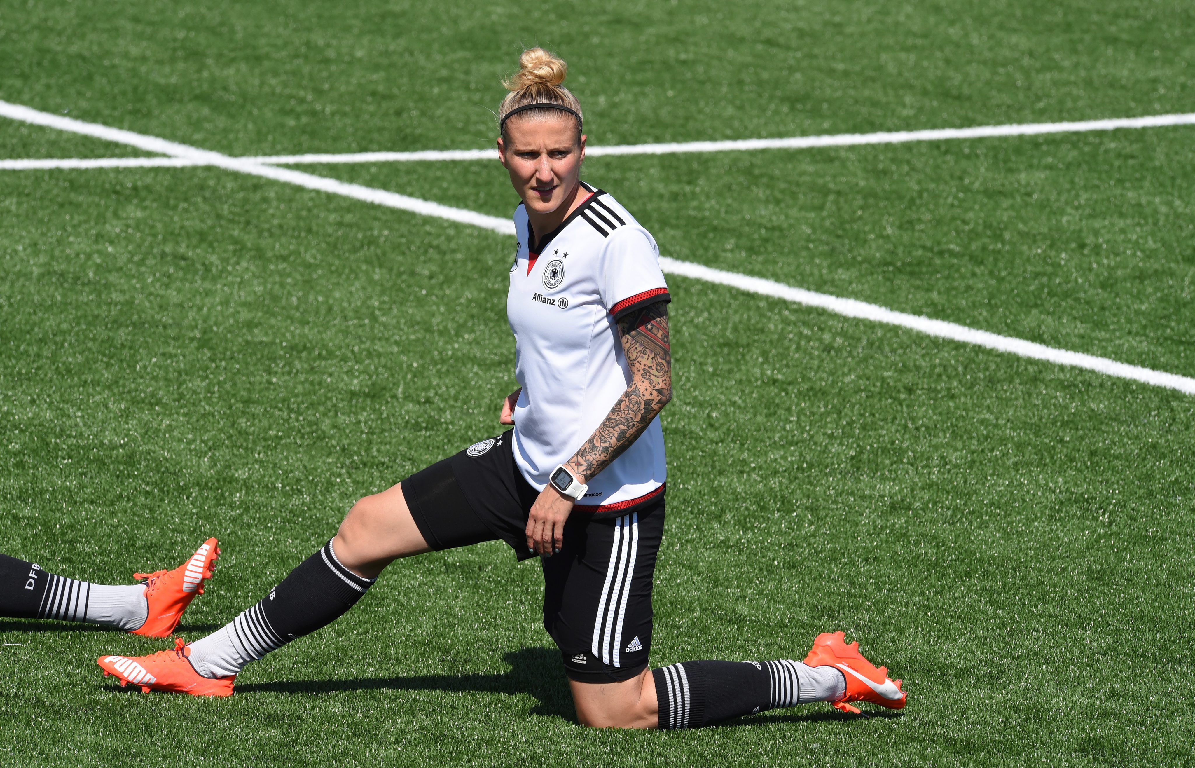 Germanys Anja Mittag stretch during a training session at the Avenue Bois-de-Boulogne, Laval in Montreal, Canada.