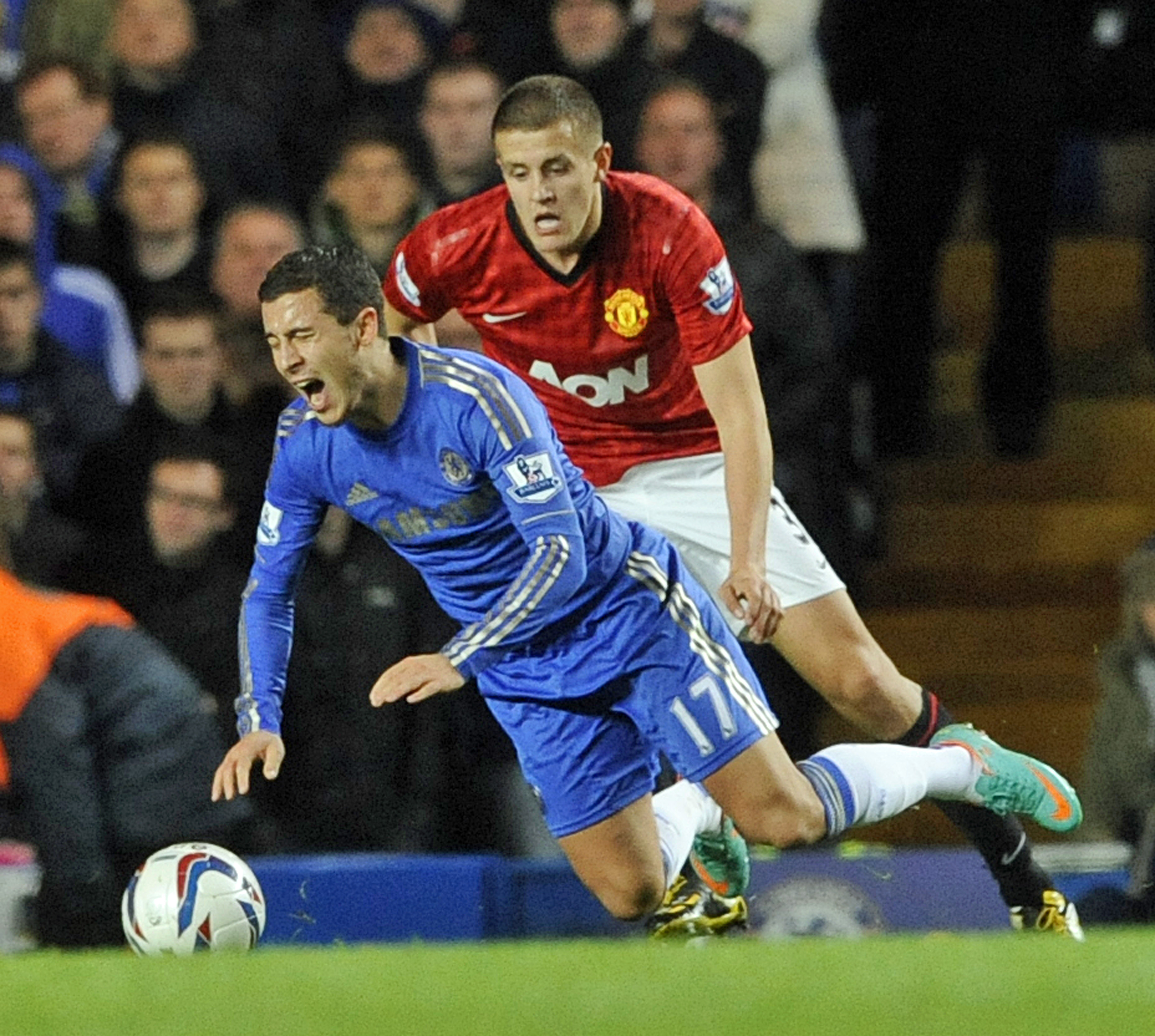 epa03454067 Chelsea's Eden Hazard is brought down Manchester United's Scott Wooton(R) , during this evenings League Cup  match at Stamford Bridge, London, Britain, 31 October 2012.  EPA/GERRY PENNY DataCo terms and conditions apply. http//www.epa.eu/downloads/DataCo-TCs.pdf