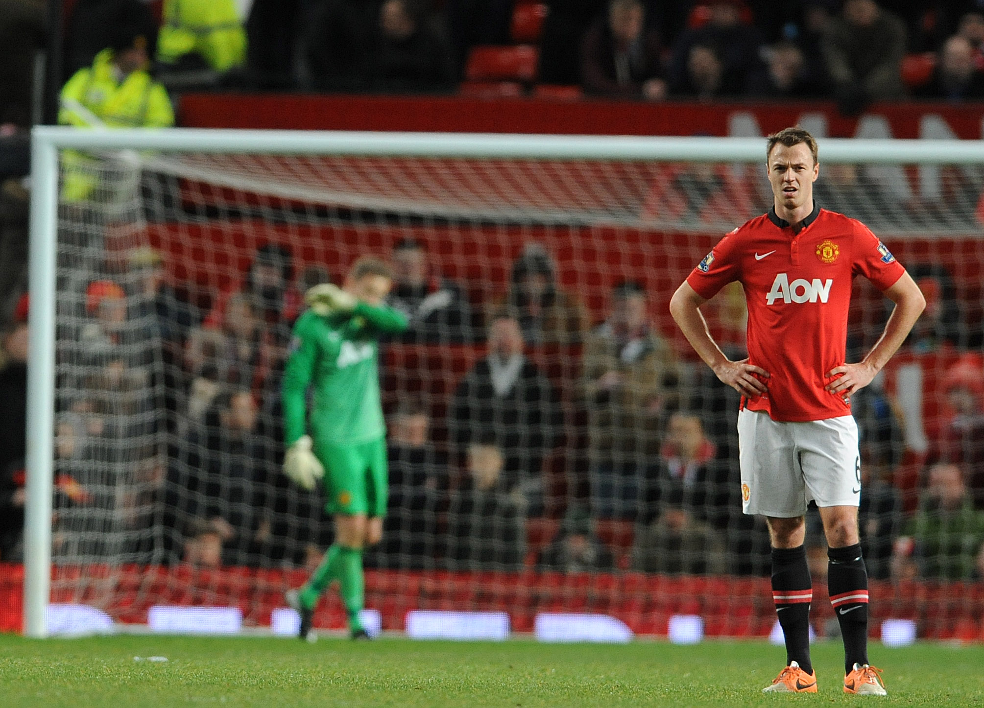 epa04009280 Manchester United's Anders Lindegaard ( L ) and Manchester United's Jonny Evans ( R ) react after Swansea City's Wilfried Bony scores the winning goal during the FA cup 3rd round soccer match at Old Trafford, Manchester, Britain, 05 January 2014.  EPA/PETER POWELL https://www.epa.eu/downloads/DataCo-TCs.pdf