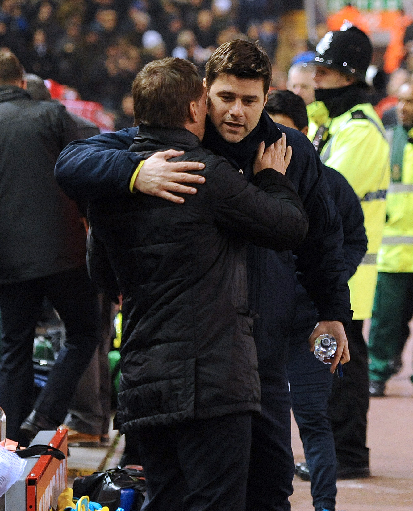 epa04613476 Tottenham Hotspur's manager Mauricio Pochettino (R) and Liverpool's manager Brendan Rodgers (L) embrace before the English Premier League soccer match between Liverpool and Tottenham Hotspur at the Anfield in Liverpool, Britain, 10 February 2015.  EPA/PETER POWELL DataCo terms and conditions apply 
http://www.epa.eu/files/Terms%20and%20Conditions/DataCo_Terms_and_Conditions.pdf