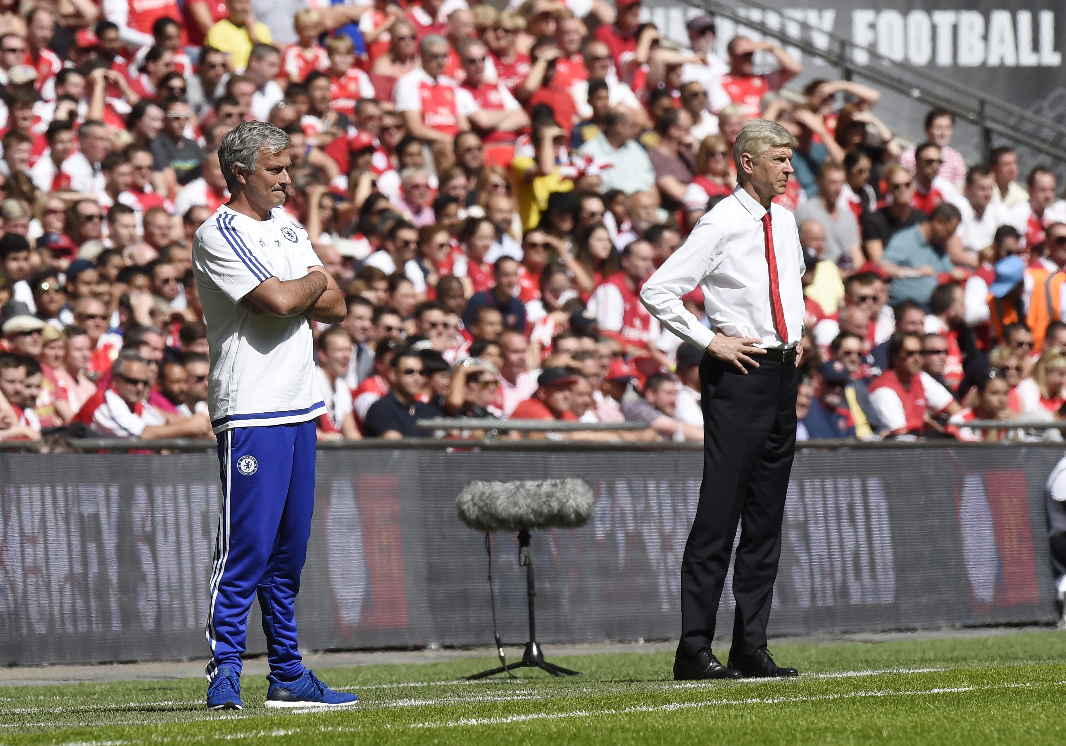 Chelsea manager Jose Mourinho (L) and Arsenal's manager Arsene Wenger (R) give instructions to their players during their English FA Community Shield soccer match between Chelsea and Arsenal in Wembley stadium in London, Britain, 02 August 2015.  (Photo by Facundo Arrizabalaga/EPA)