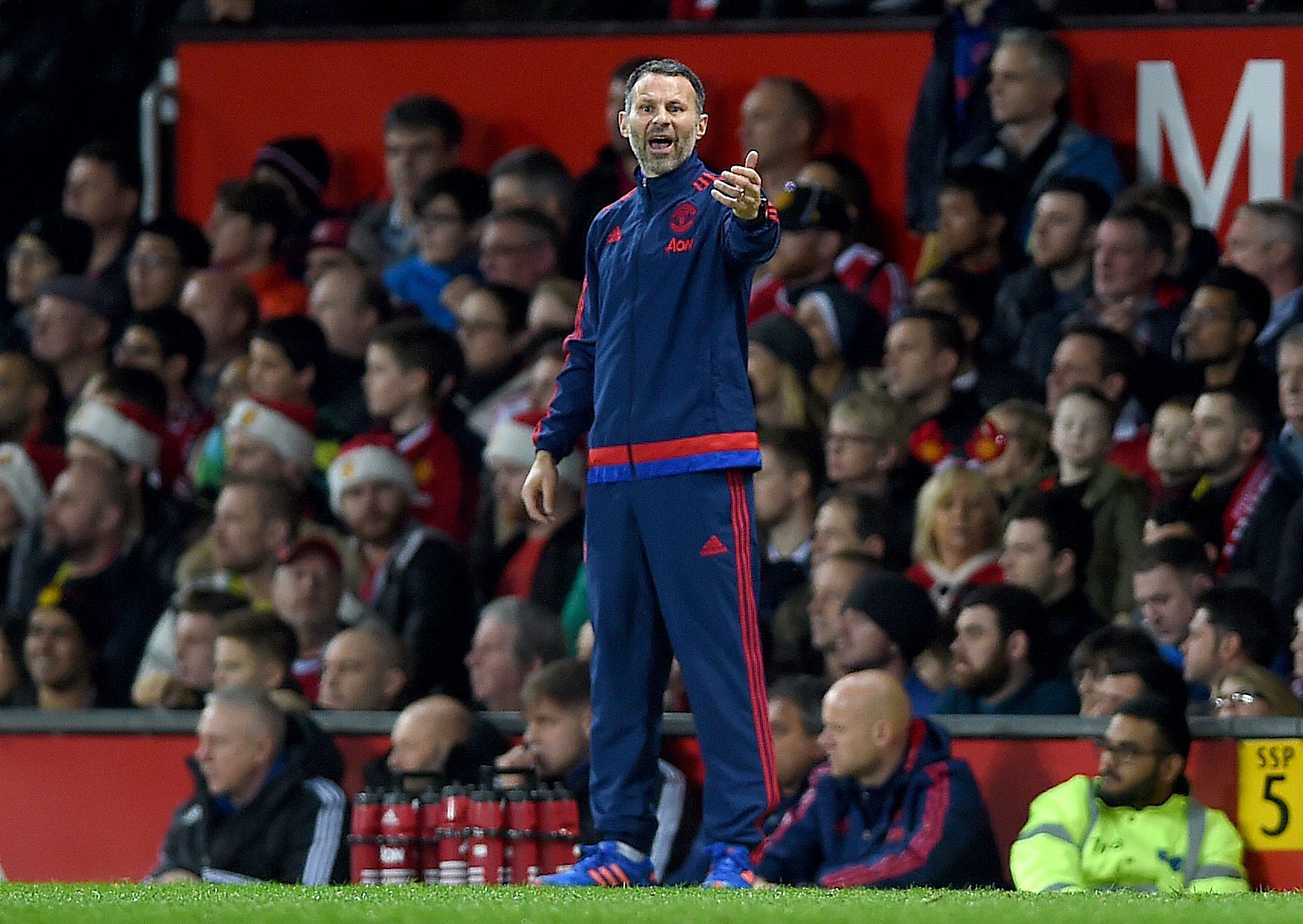 Manchester United assistant manager Ryan Giggs (C) reacts during the English Premier League soccer match between Manchester United and Norwich City at Old Trafford, Manchester, Britain, 19 December 2015.  (Photo by Peter Powell/EPA)