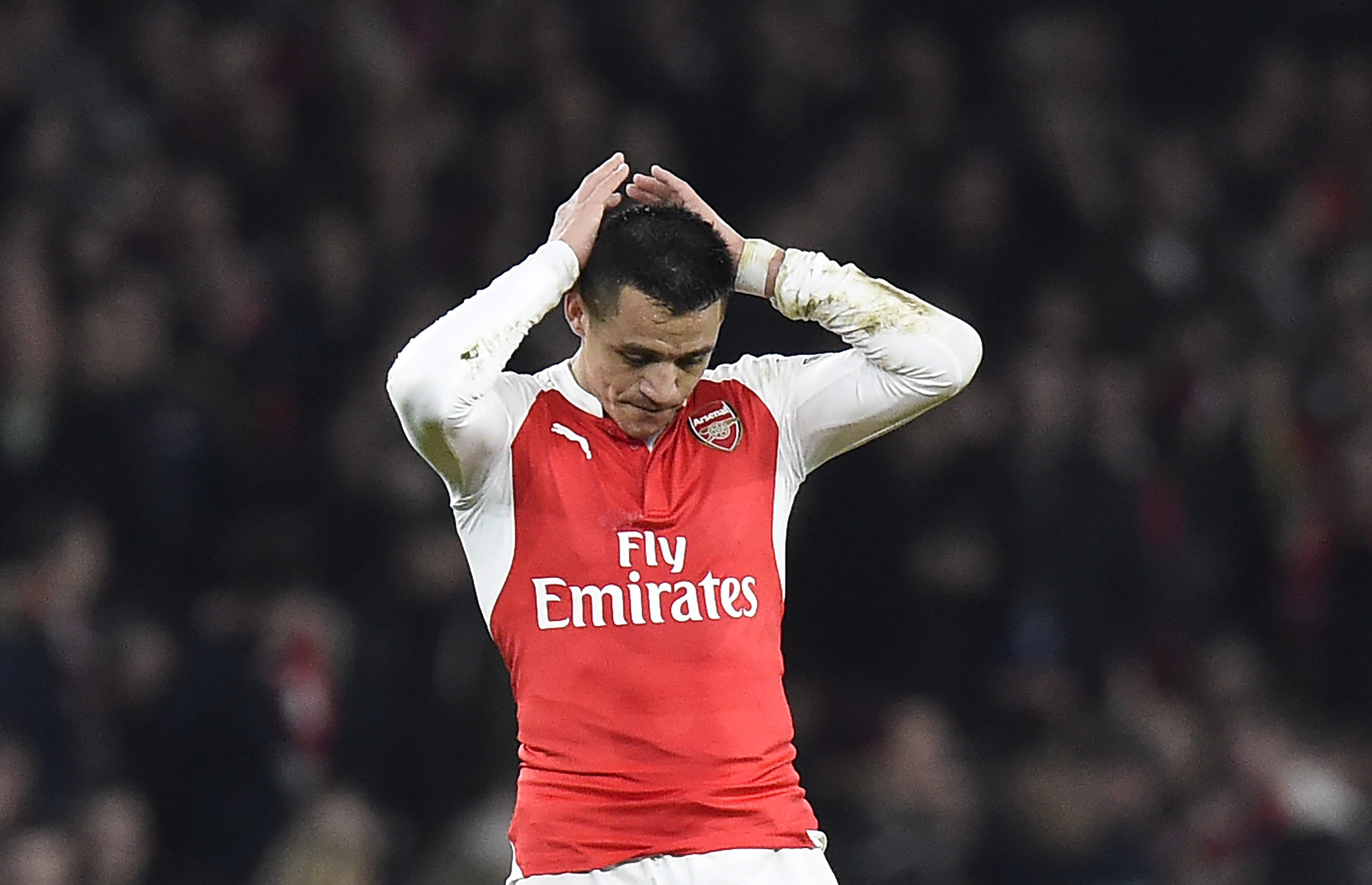 epa05123380 Arsenal Alexis Sanchez reacts during the English Premier League game between Arsenal and Chelsea at the Emirates stadium in London, Britain, 24 January 2016.  EPA/FACUNDO ARRIZABALAGA EDITORIAL USE ONLY. No use with unauthorized audio, video, data, fixture lists, club/league logos or 'live' services. Online in-match use limited to 75 images, no video emulation. No use in betting, games or single club/league/player publications