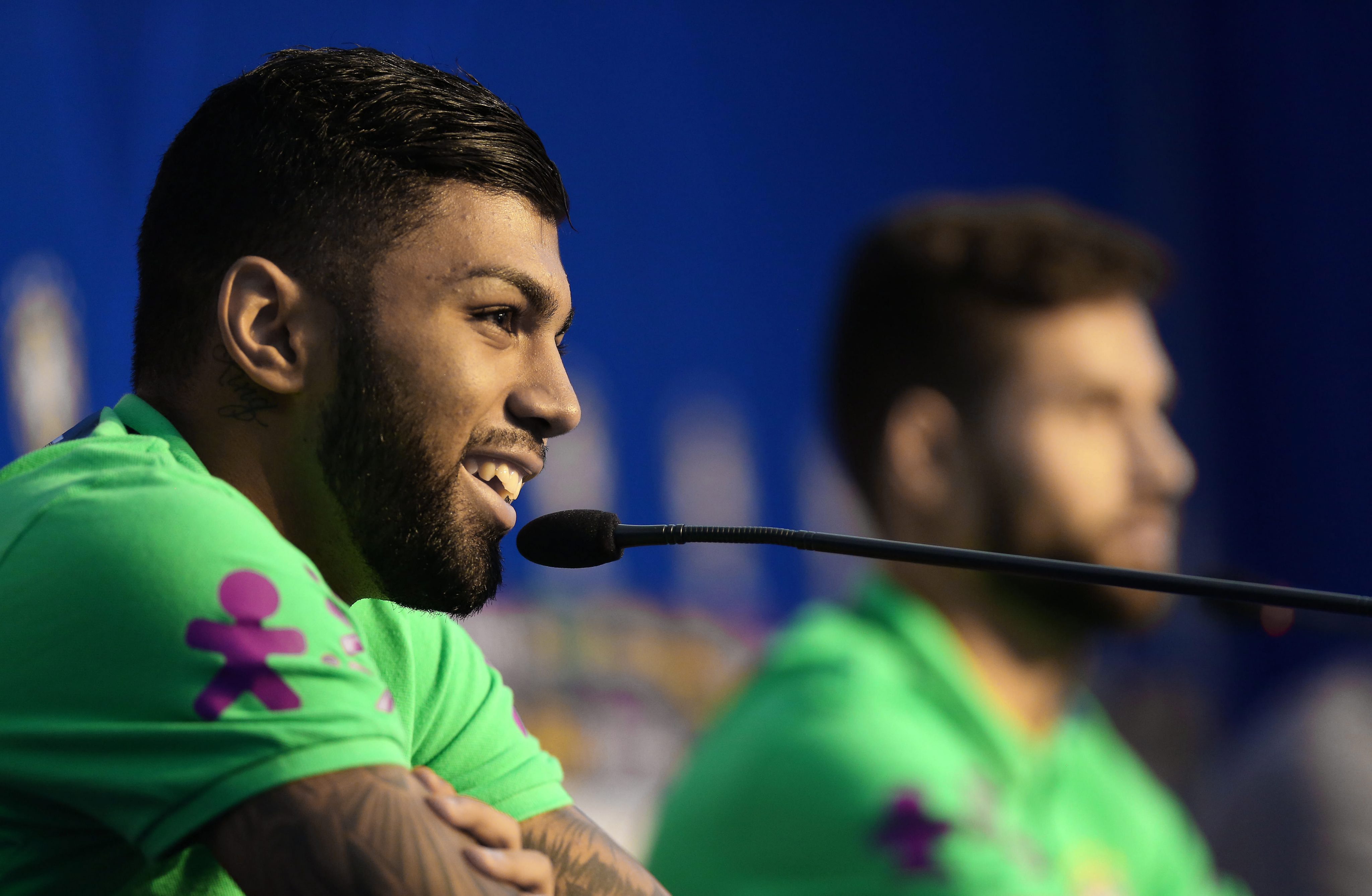 epa05232952 Brazil's national soccer team players Gabriel Barbosa (L) and Felipe Augusto (R) speak during a press meeting at Vila Ventura hotel in Viamao, Brazil, on 27 March 2016. Brazil's team is preparing for a qualifying soccer match against Paraguay on 29 March to the World Cup Russia 2018.  EPA/Silvio Avila