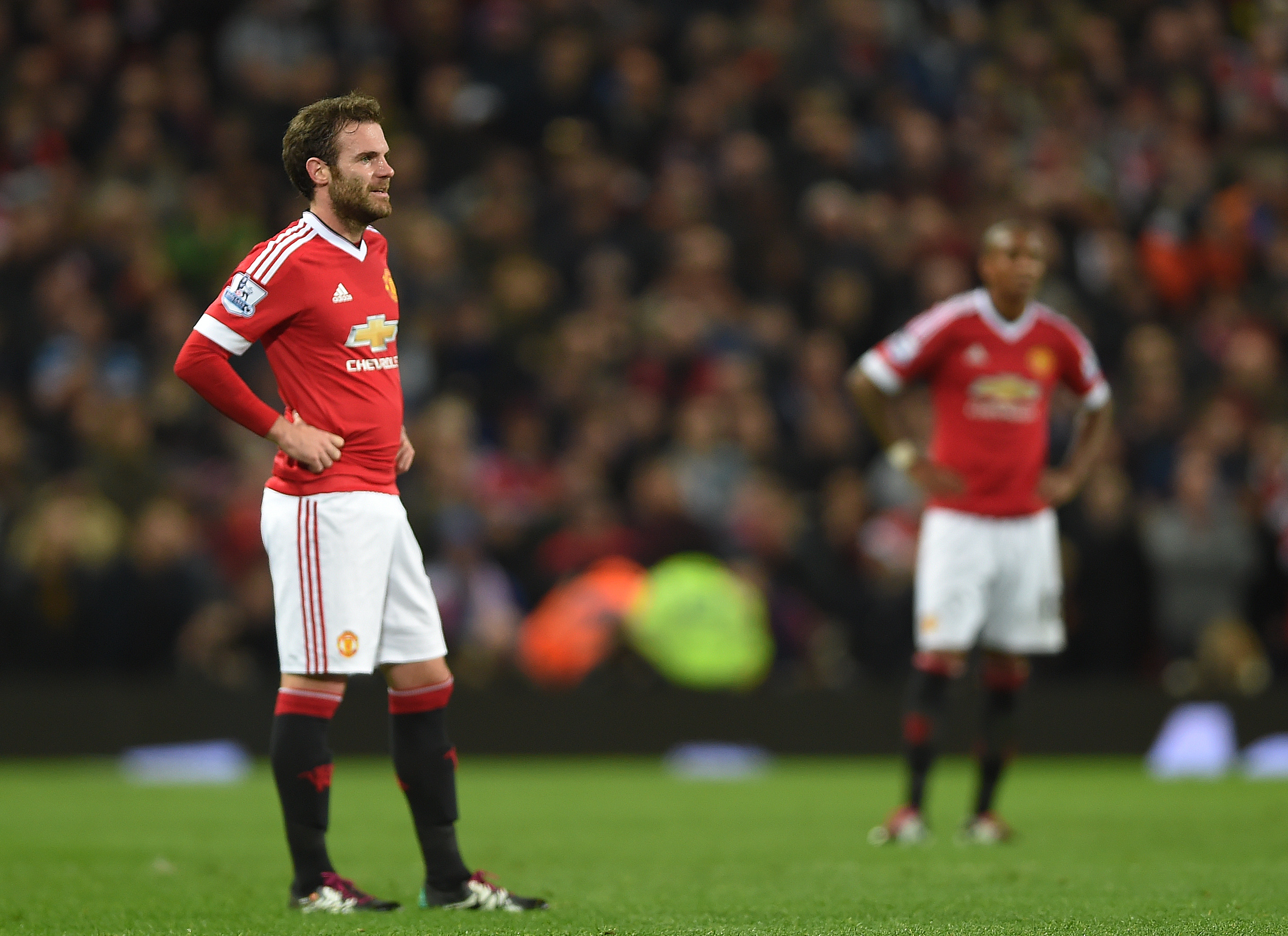 epa05082545 Manchester United's Ashley Young (R) and Manchester United's Juan Mata (L) react during the English Premier League soccer match between Manchester United and Chelsea at Old Trafford, Manchester, Britain, 28 December 2015.  EPA/PETER POWELL EDITORIAL USE ONLY. No use with unauthorized audio, video, data, fixture lists, club/league logos or 'live' services. Online in-match use limited to 75 images, no video emulation. No use in betting, games or single club/league/player publications