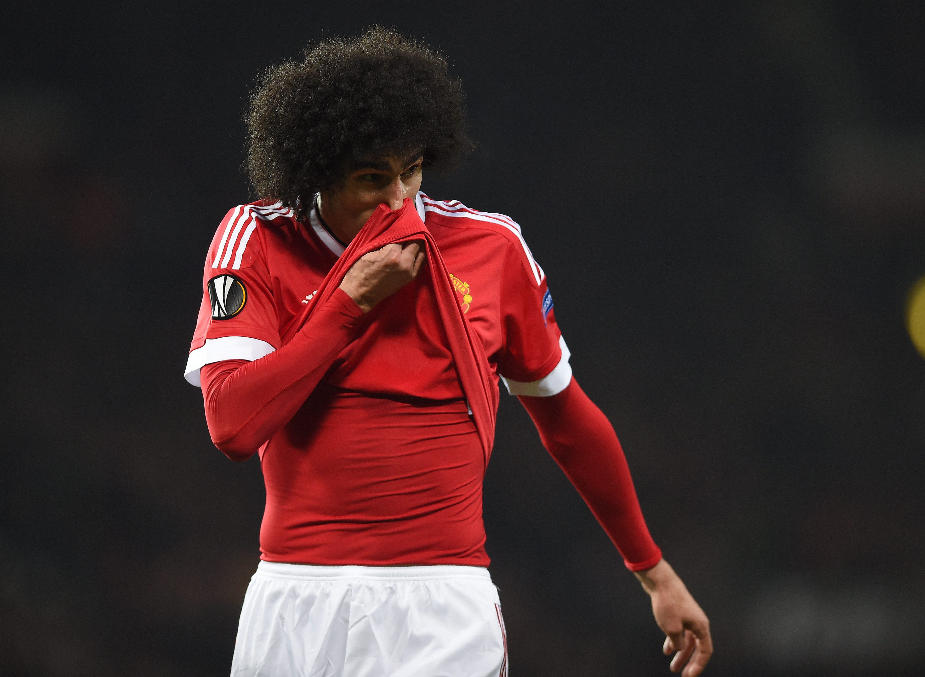 epa05217084 Manchester United's Marouane Fellaini reacts during the UEFA Europa League round of 16 soccer match between Manchester United and Liverpool at Old Trafford in Manchester, Britain, 17 March 2016.  EPA/PETER POWELL