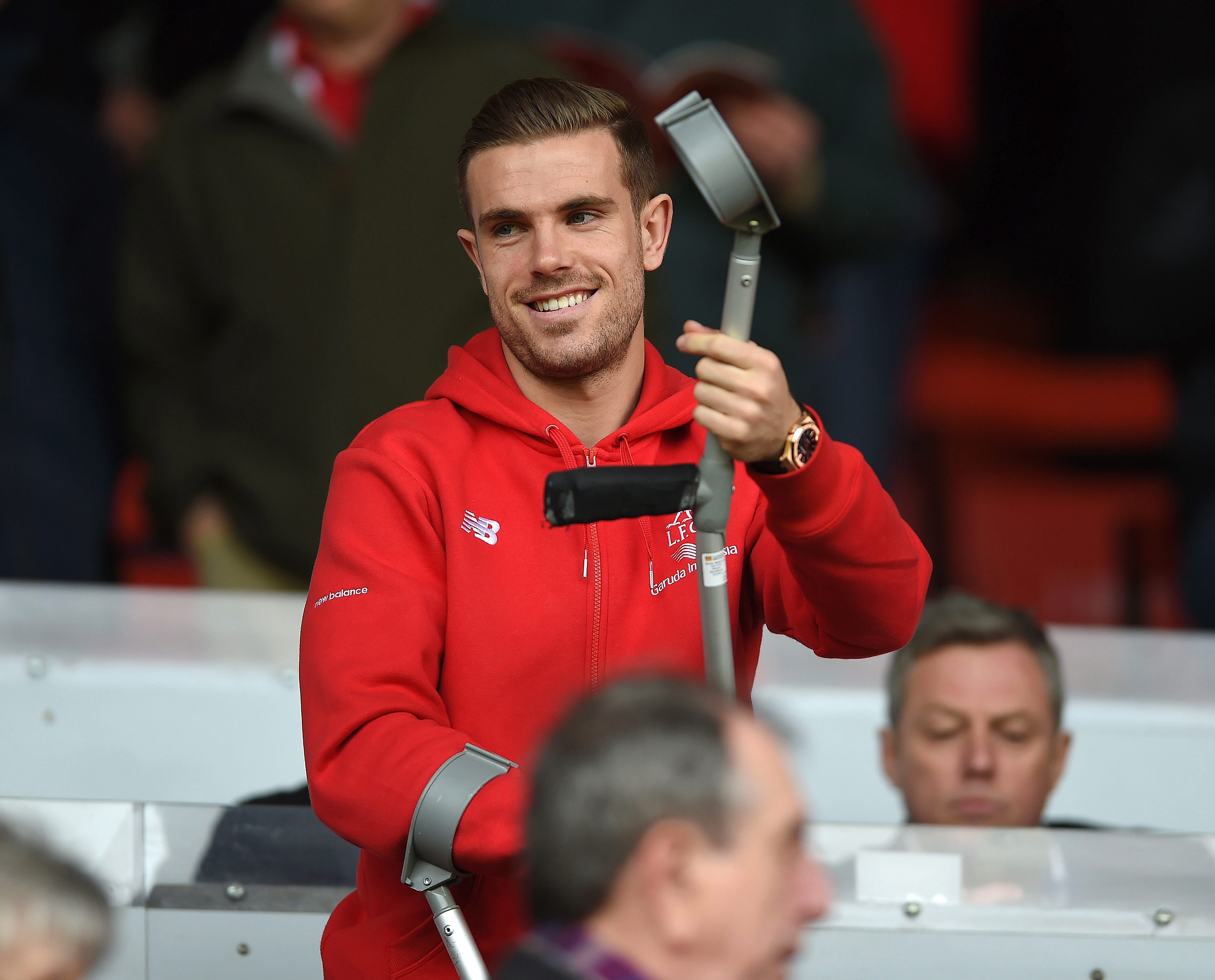 epa05252877 Liverpool's Jordan Henderson watches the game from the stands during the English Premier League soccer match between Liverpool and Stoke City at the Anfield, Manchester, Britain, 10 April 2016.  EPA/PETER POWELL EDITORIAL USE ONLY. No use with unauthorized audio, video, data, fixture lists, club/league logos or 'live' services. Online in-match use limited to 75 images, no video emulation. No use in betting, games or single club/league/player publications