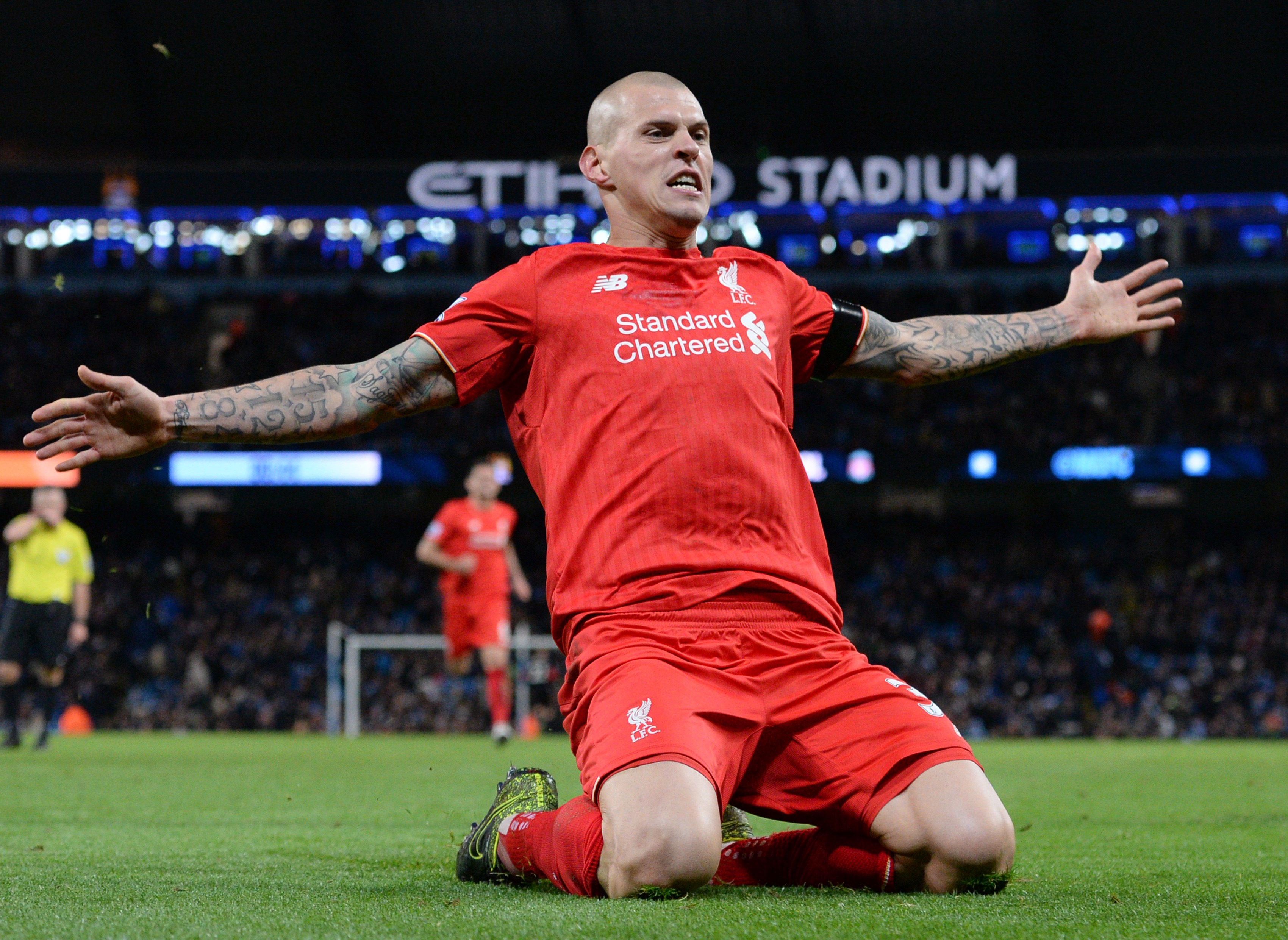 Liverpool's Slovakian defender Martin Skrtel celebrates after scoring their fourth goal of the English Premier League football match between Manchester City and Liverpool at The Etihad stadium in Manchester, north west England on November 21, 2015. AFP PHOTO / OLI SCARFF

RESTRICTED TO EDITORIAL USE. No use with unauthorized audio, video, data, fixture lists, club/league logos or 'live' services. Online in-match use limited to 75 images, no video emulation. No use in betting, games or single club/league/player publications.        (Photo credit should read OLI SCARFF/AFP/Getty Images)