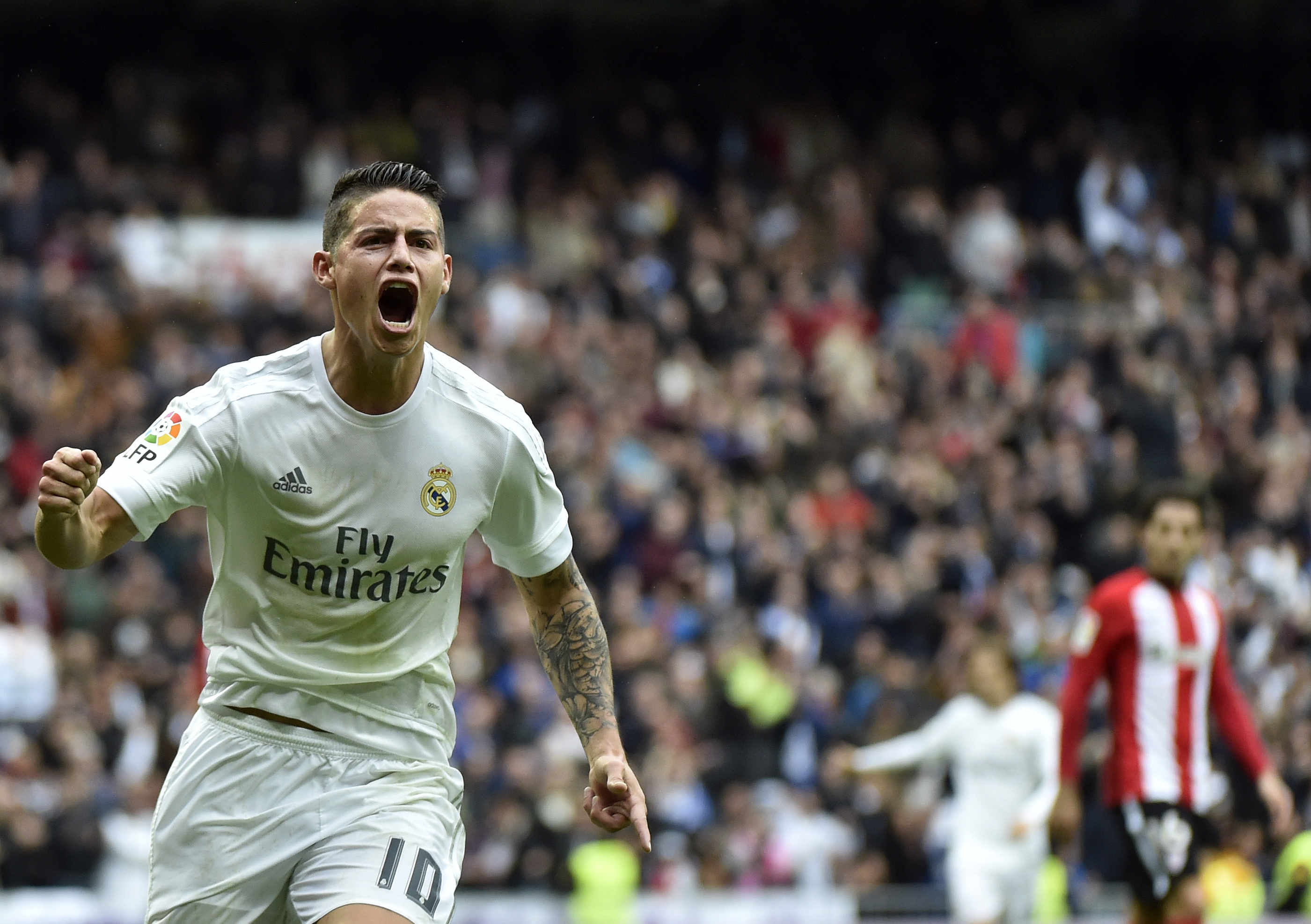 Real Madrid's Colombian midfielder James Rodriguez celebrates after scoring during the Spanish league football match Real Madrid CF vs Athletic Club Bilbao at the Santiago Bernabeu stadium in Madrid on February 13, 2016. / AFP / GERARD JULIEN        (Photo credit should read GERARD JULIEN/AFP/Getty Images)