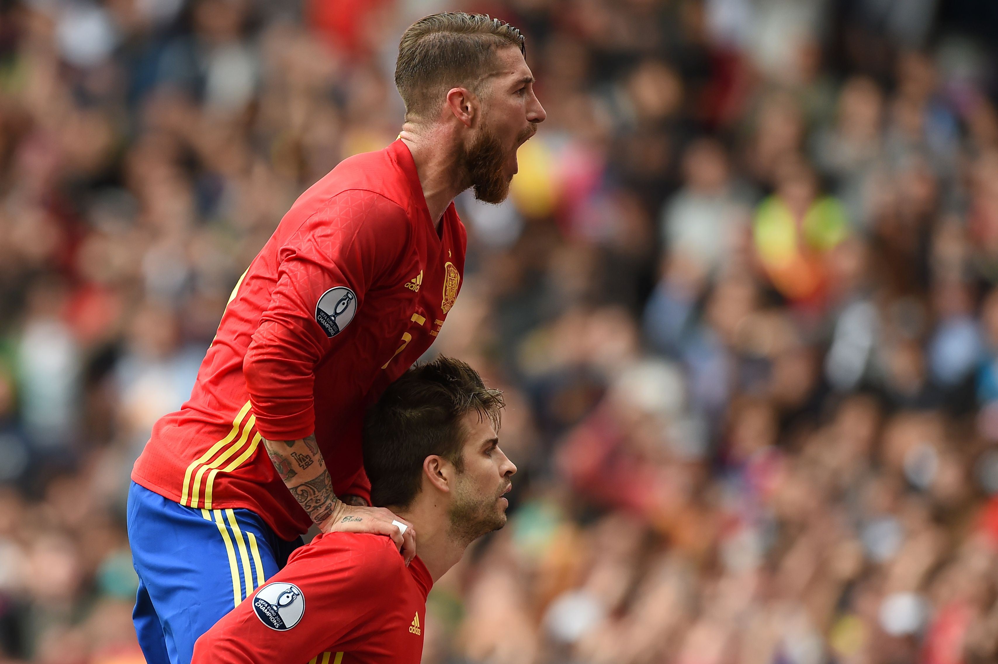 Spain's defender Gerard Pique and Spain's defender Sergio Ramos celebrate after Pique scored the opening goal during the Euro 2016 group D football match between Spain and Czech Republic at the Stadium Municipal in Toulouse on June 13, 2016. / AFP / NICOLAS TUCAT        (Photo credit should read NICOLAS TUCAT/AFP/Getty Images)