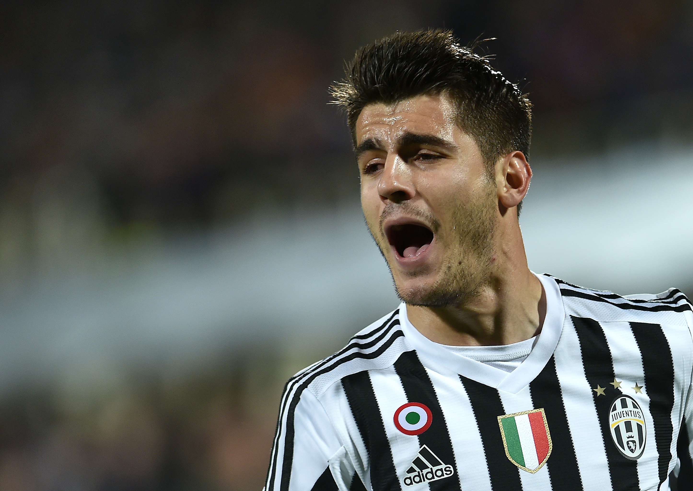 Juventus' Spanish forward Alvaro Morata celebrates after scoring a goal during the Italian Serie A football match Fiorentina vs Juventus on April 24, 2016 at the Artemio Franchi stadium in Florence.  / AFP / ALBERTO PIZZOLI        (Photo credit should read ALBERTO PIZZOLI/AFP/Getty Images)