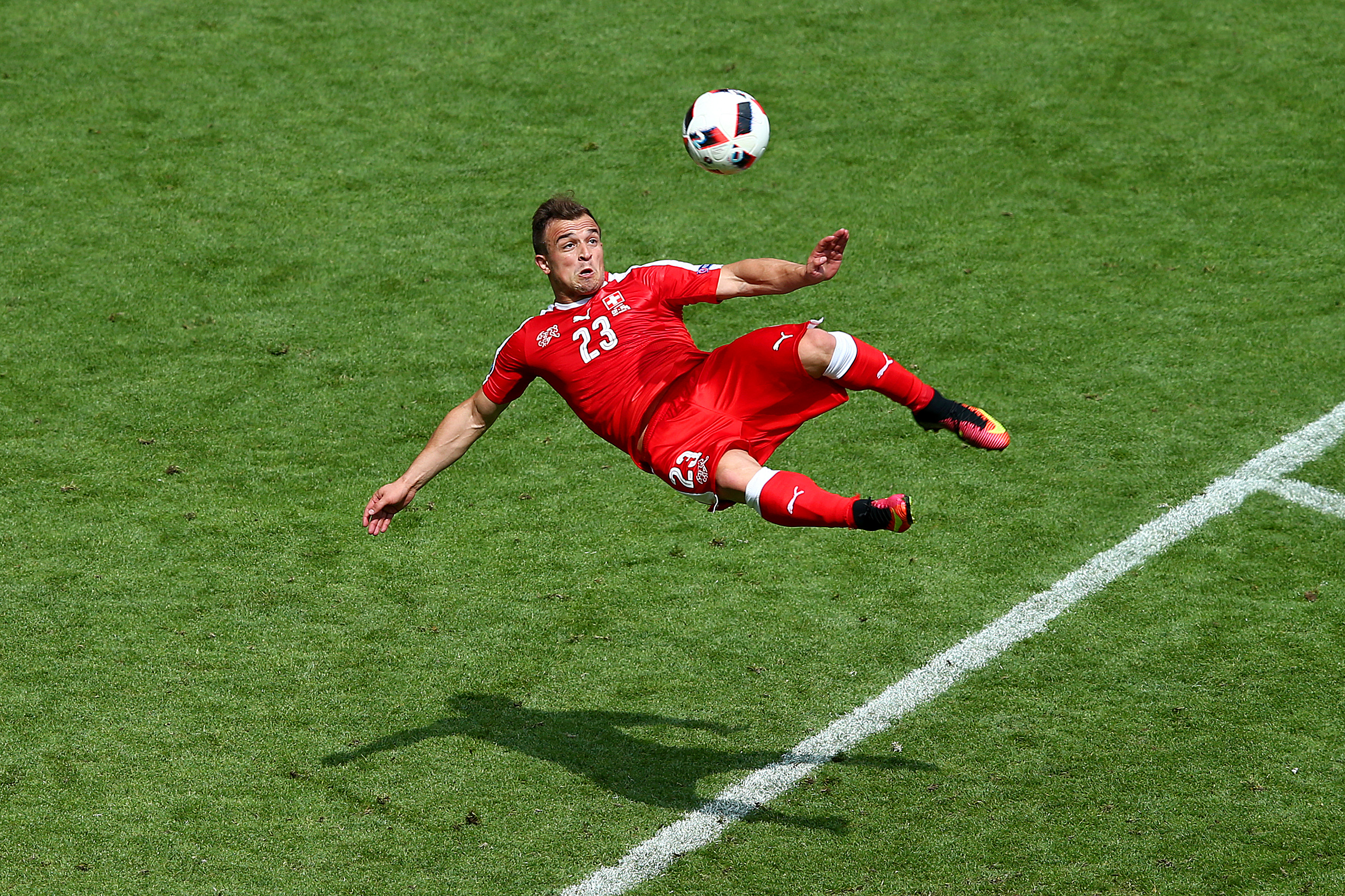 SAINT-ETIENNE, FRANCE - JUNE 25:  Xherdan Shaqiri of Switzerland scores his team's first goal during the UEFA EURO 2016 round of 16 match between Switzerland and Poland at Stade Geoffroy-Guichard on June 25, 2016 in Saint-Etienne, France.  (Photo by Alex Livesey/Getty Images)