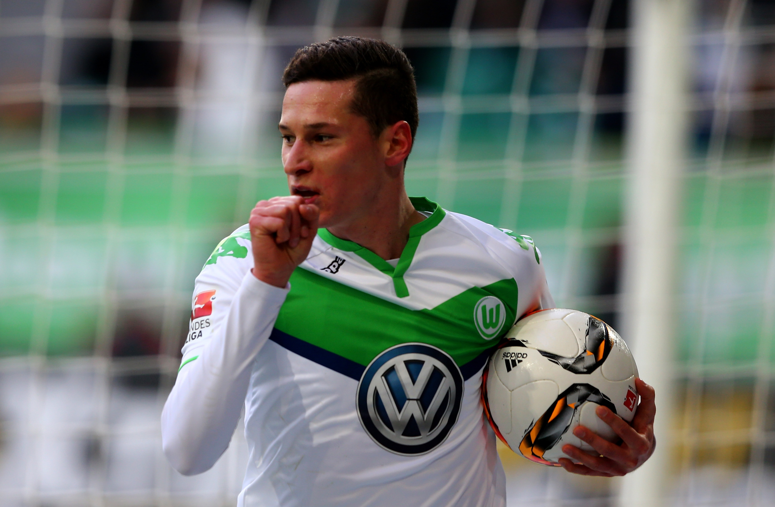 WOLFSBURG, GERMANY - FEBRUARY 13:  Julian Draxler of Wolfsburg celebrates after scoring the opening goal during the Bundesliga match between VfL Wolfsburg and FC Ingolstadt at Volkswagen Arena on February 13, 2016 in Wolfsburg, Germany.  (Photo by Martin Rose/Bongarts/Getty Images)