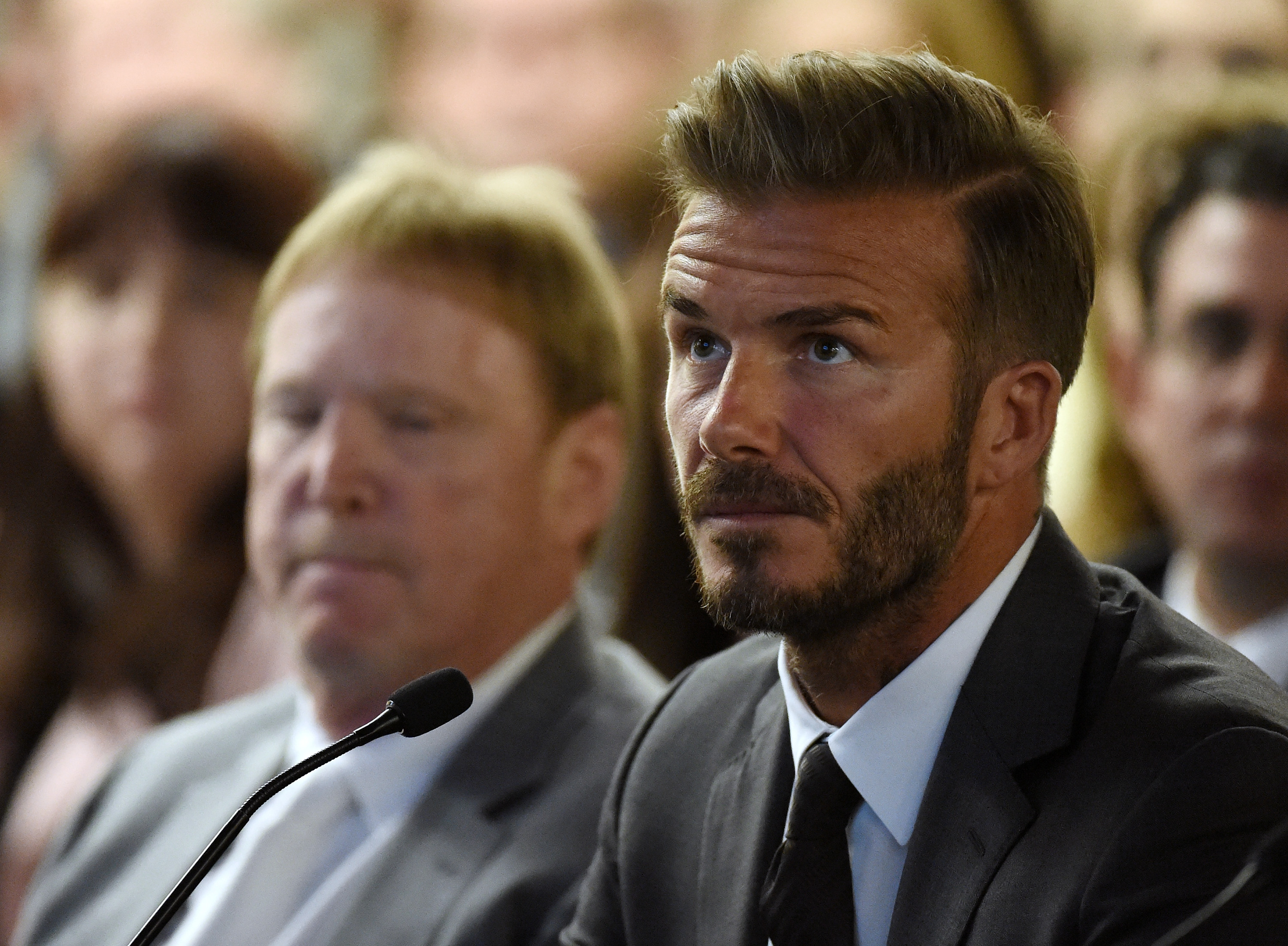 LAS VEGAS, NV - APRIL 28:  Oakland Raiders owner Mark Davis (L) and former soccer player David Beckham attend a Southern Nevada Tourism Infrastructure Committee meeting at UNLV on April 28, 2016 in Las Vegas, Nevada. Davis told the committee he is willing to spend USD 500 million as part of a deal to move the team to Las Vegas if a proposed USD 1.3 billion, 65,000-seat domed stadium is built by casino magnate Sheldon Adelson's Las Vegas Sands Corp. and real estate agency Majestic Realty, possibly on a vacant 42-acre lot a few blocks east of the Las Vegas Strip recently purchased by UNLV.  (Photo by Ethan Miller/Getty Images)