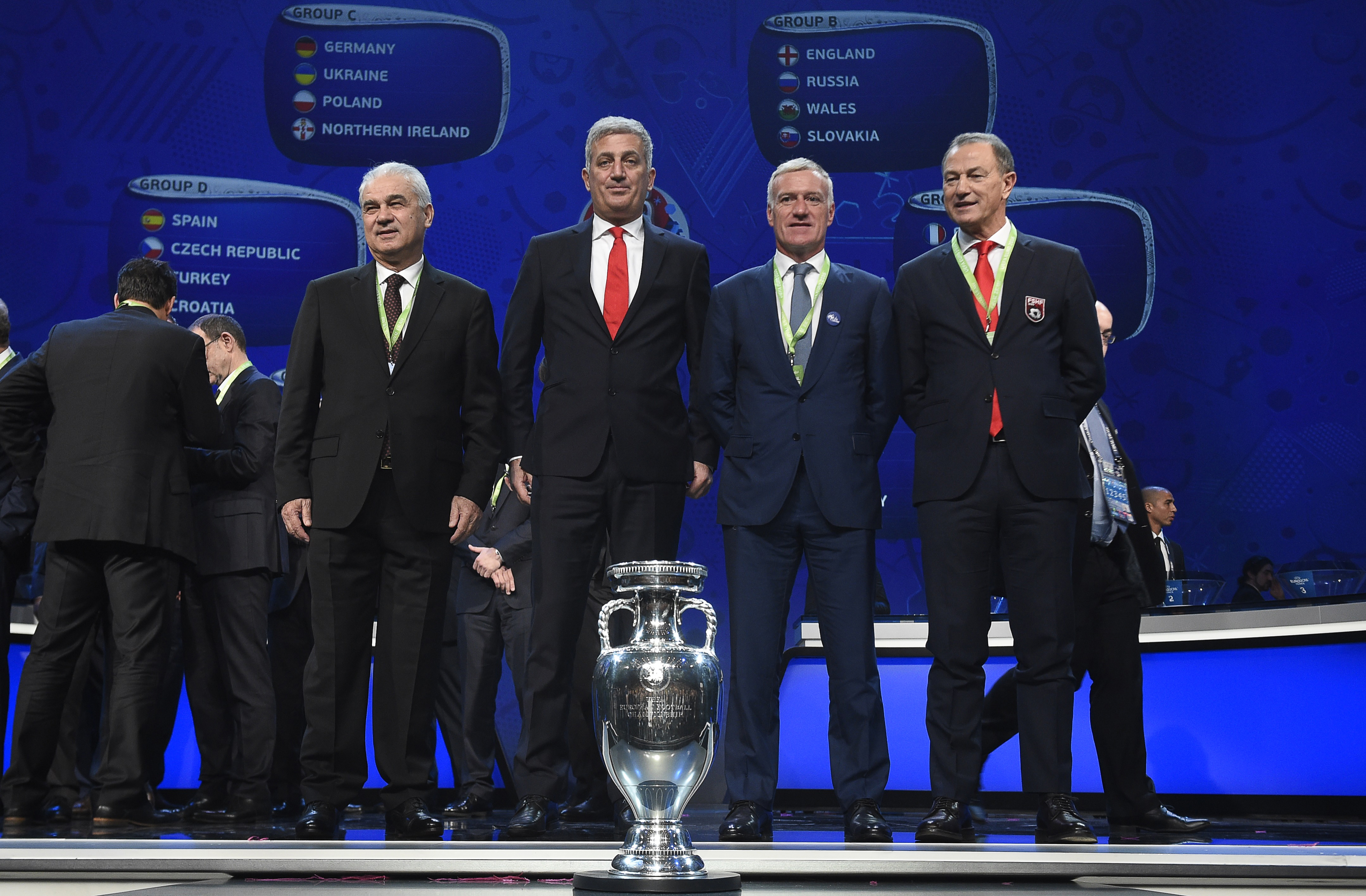 Representatives of teams drawn in group A (L-R) Romania's coach Anghel Iordanescu, Switzerland's coach Vladimir Petkovic, France's coach Didier Deschamps and Albania's Italian coach Gianni de Biasi pose after the final draw of the UEFA Euro 2016 football tournament in Paris on December 12, 2015.  AFP PHOTO / LIONEL BONAVENTURE / AFP / LIONEL BONAVENTURE        (Photo credit should read LIONEL BONAVENTURE/AFP/Getty Images)