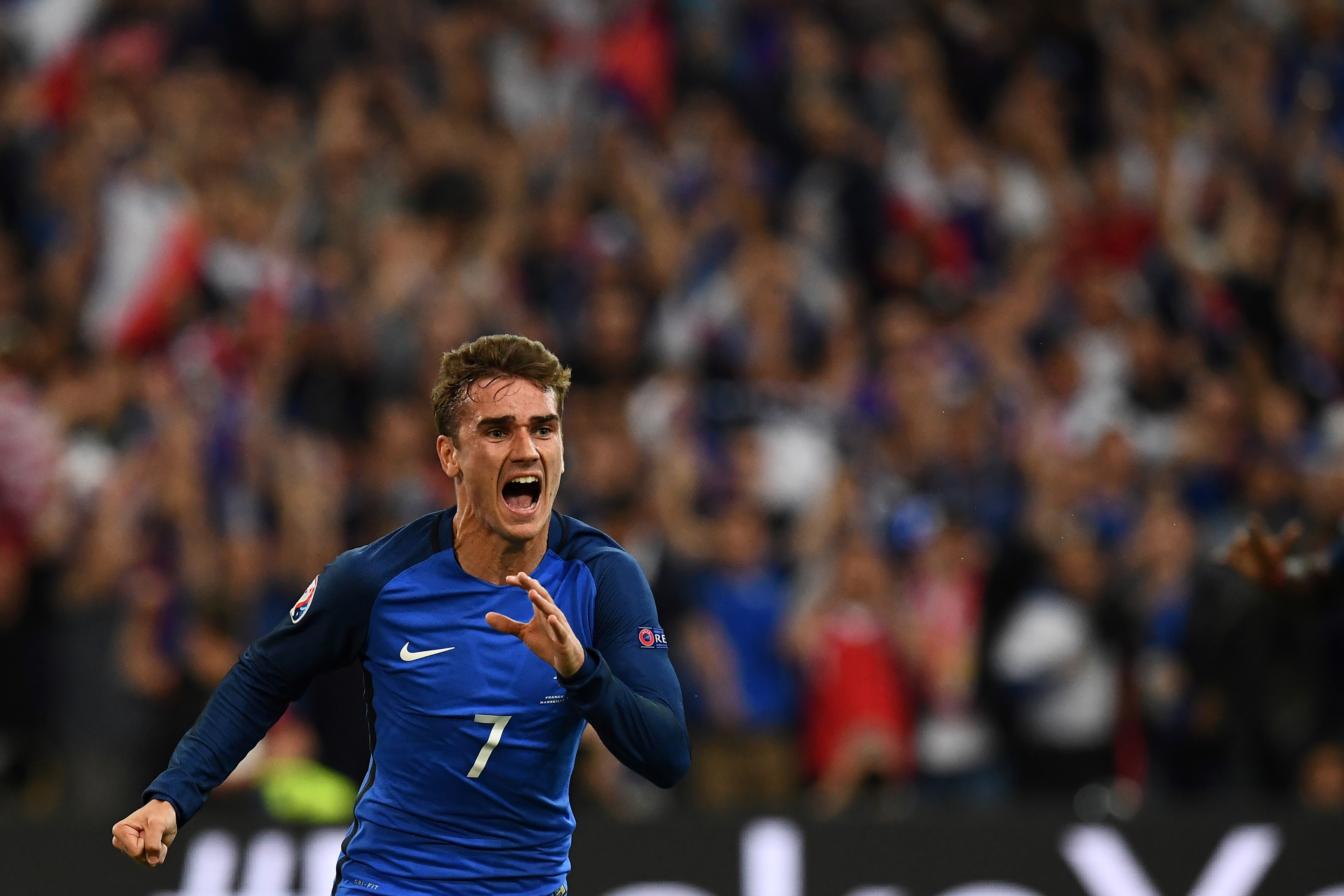 France's forward Antoine Griezmann reacts after scoring France's first goal during the Euro 2016 group A football match between France and Albania at the Velodrome stadium in Marseille on June 15, 2016.
France beat Albania 2-0.  / AFP / FRANCK FIFE        (Photo credit should read FRANCK FIFE/AFP/Getty Images)