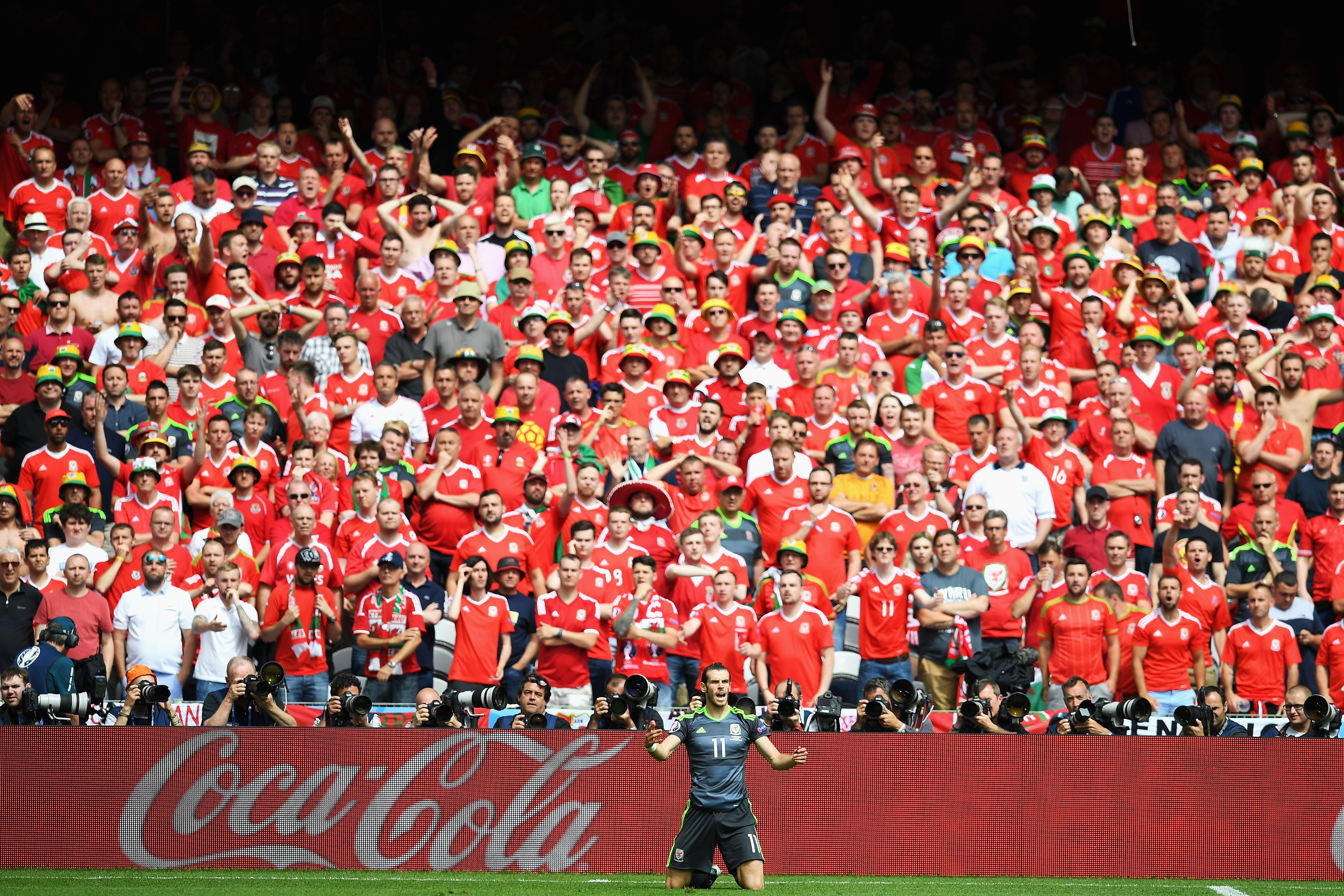 LENS, FRANCE - JUNE 16: Gareth Bale of Wales appeals to the referee in front of Wales supporters during the UEFA EURO 2016 Group B match between England and Wales at Stade Bollaert-Delelis on June 16, 2016 in Lens, France.  (Photo by Matthias Hangst/Getty Images)