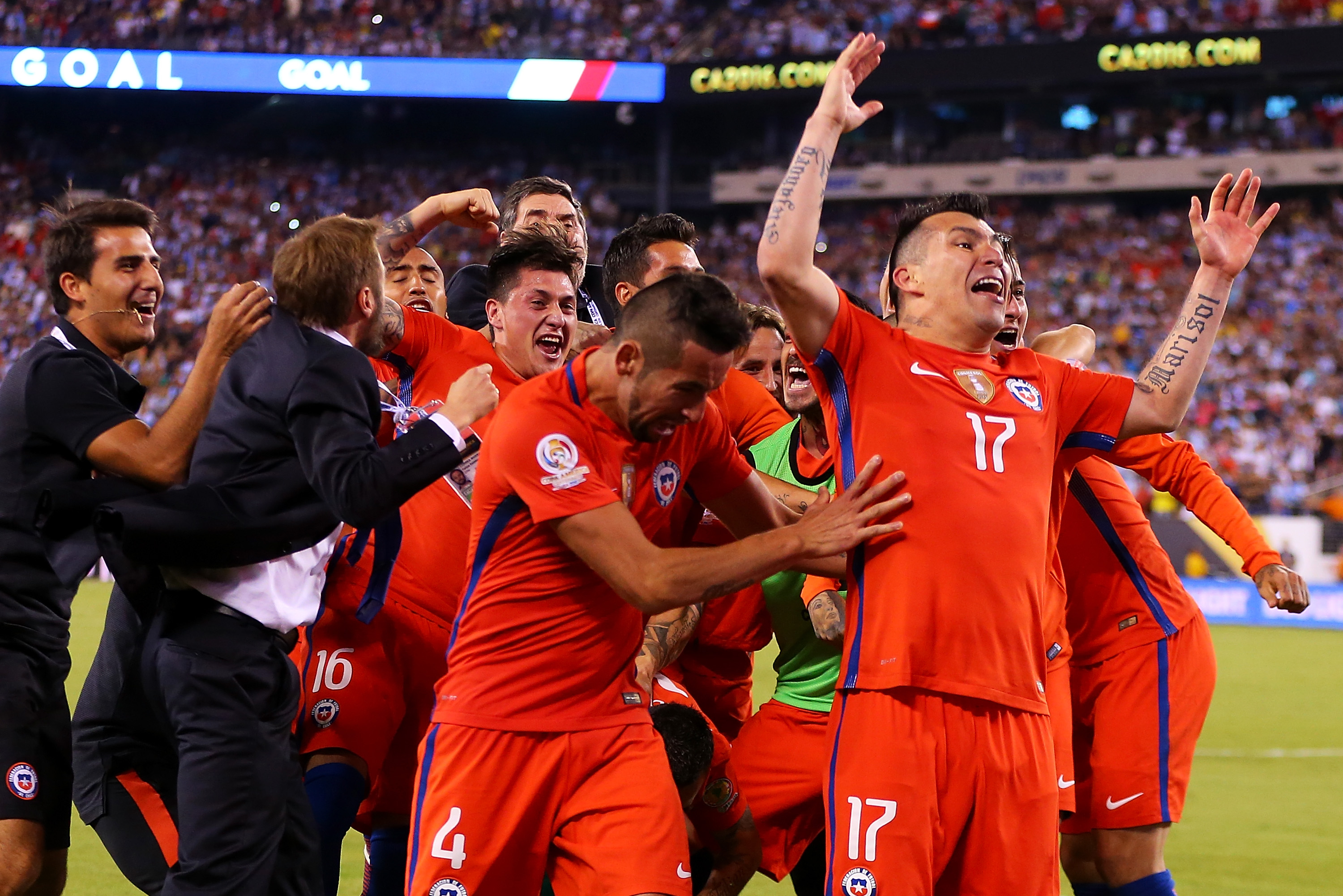 EAST RUTHERFORD, NJ - JUNE 26: Gary Medel #17 and Mauricio Isla #4 of Chile celebrate after defeating Argentina to win the Copa America Centenario Championship match at MetLife Stadium on June 26, 2016 in East Rutherford, New Jersey. Chile defeated Argentina 4-2 in penalty kicks. (Photo by Mike Stobe/Getty Images)