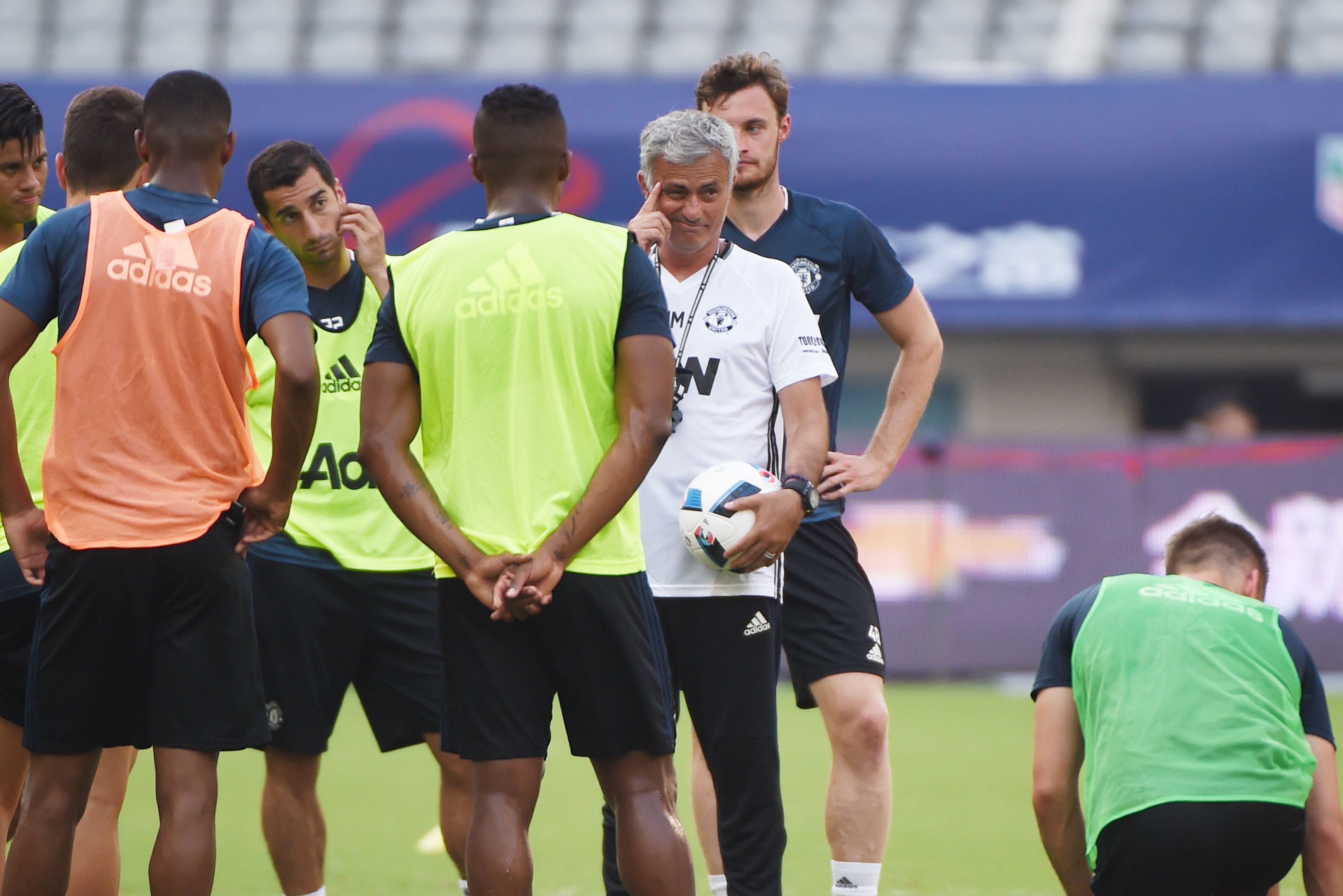 Manchester United's head coach Jose Mourinho (C) reacts as he takes part in a training session with teammates ahead of the 2016 International Champions Cup football match between Manchester United and Dortmund in Shanghai on July 21, 2016. / AFP / WANG ZHAO        (Photo credit should read WANG ZHAO/AFP/Getty Images)