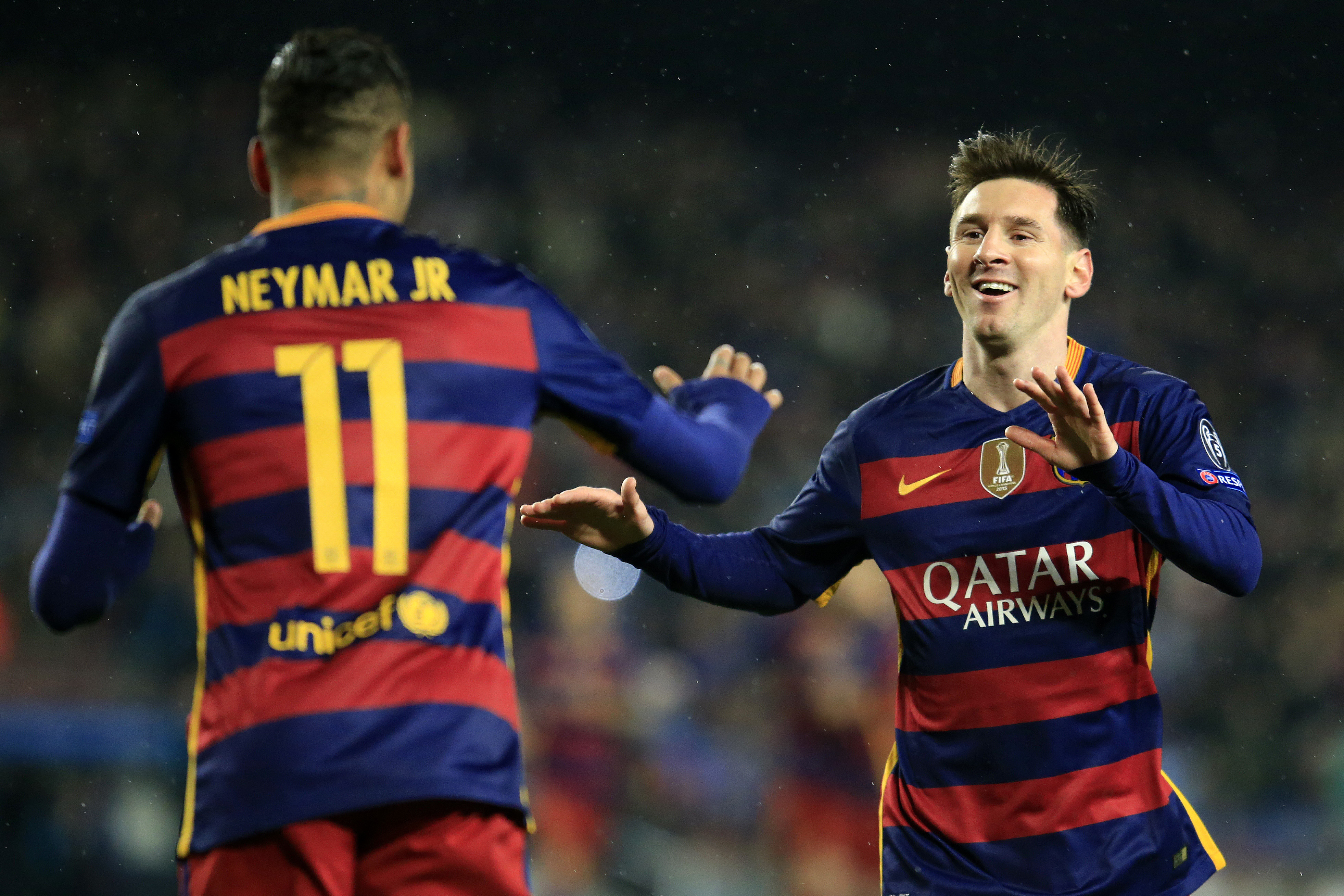 Barcelona's Brazilian forward Neymar (L) celebrates a goal with Barcelona's Argentinian forward Lionel Messi during the UEFA Champions League Round of 16 second leg football match FC Barcelona vs Arsenal FC at the Camp Nou stadium in Barcelona on March 16, 2016. / AFP / PAU BARRENA        (Photo credit should read PAU BARRENA/AFP/Getty Images)