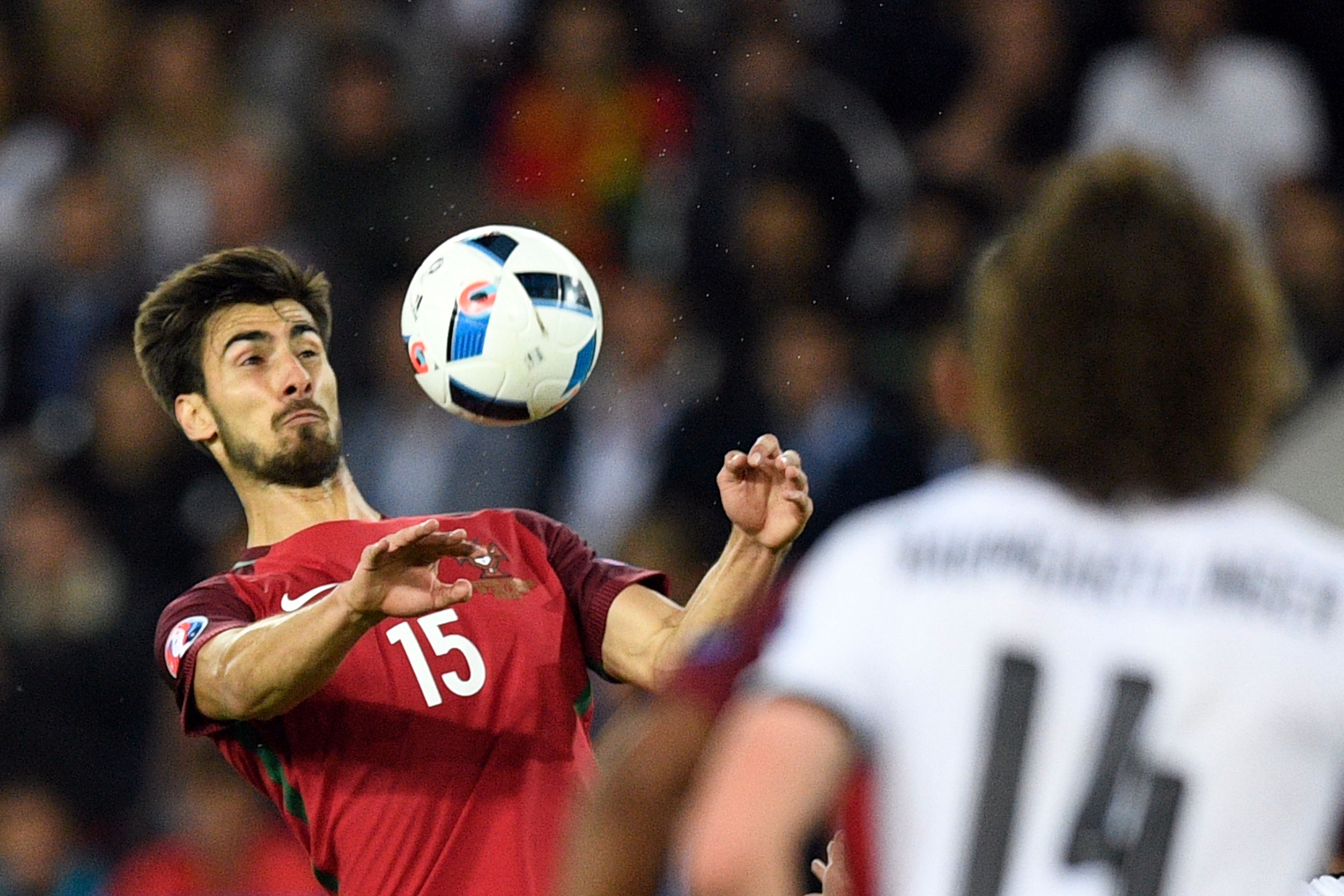Portugal's midfielder Andre Gomes (L) plays the ball during the Euro 2016 group F football match between Portugal and Austria at the Parc des Princes in Paris on June 18, 2016. / AFP / MARTIN BUREAU        (Photo credit should read MARTIN BUREAU/AFP/Getty Images)