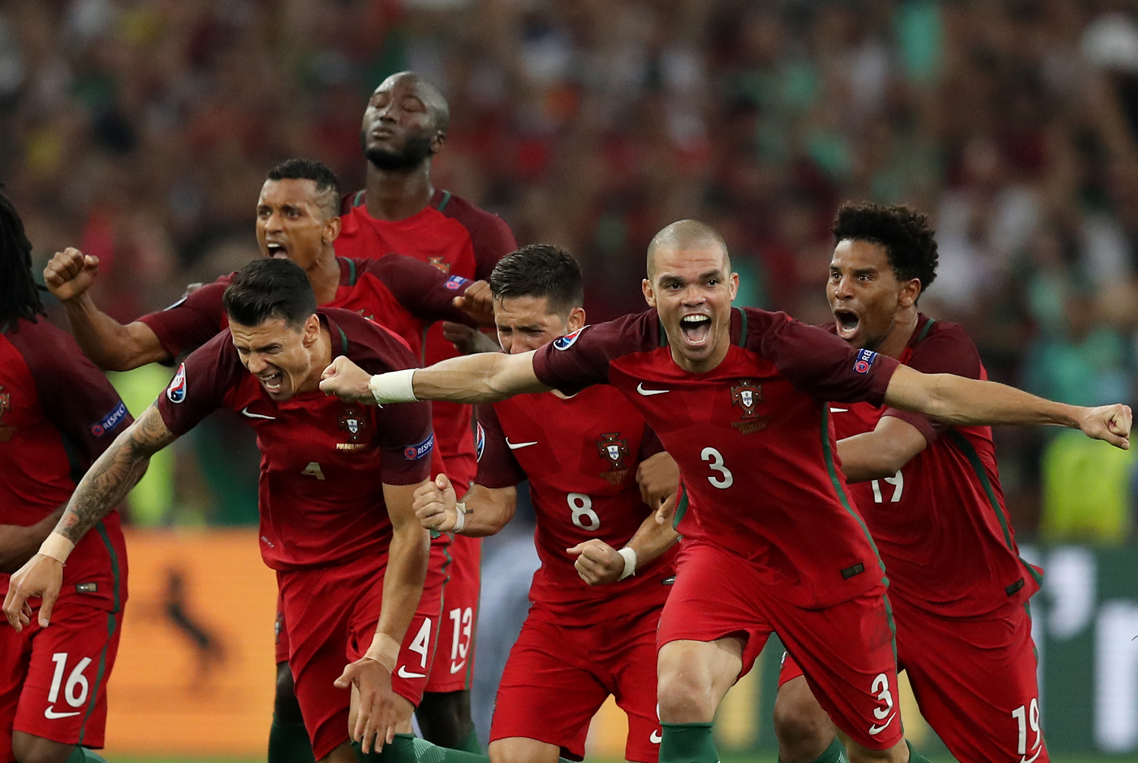 Portugal's players celebrate after winning the Euro 2016 quarter-final football match between Poland and Portugal at the Stade Velodrome in Marseille on June 30, 2016. / AFP / Valery HACHE        (Photo credit should read VALERY HACHE/AFP/Getty Images)