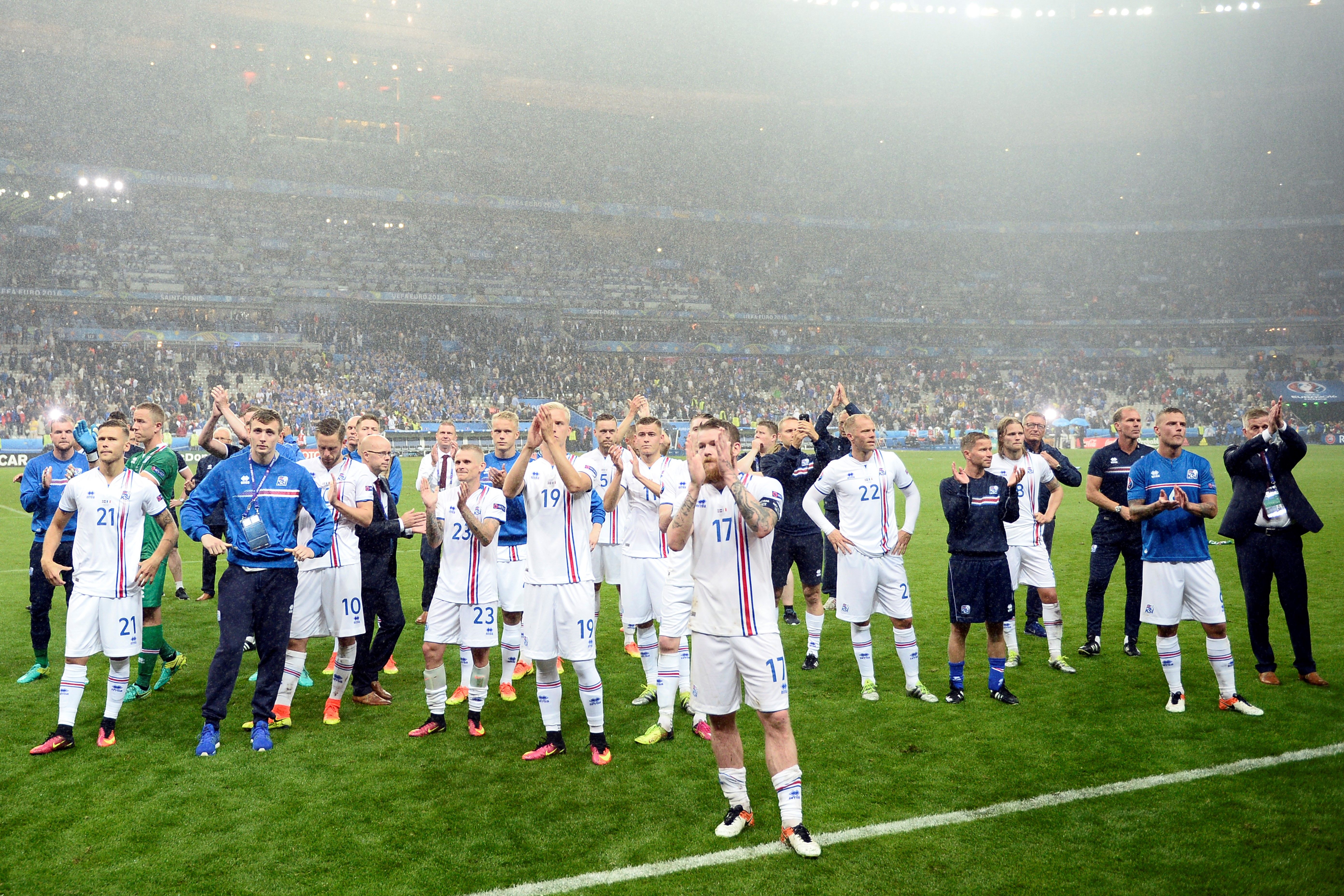 Iceland's midfielder Aron Gunnarsson (C) and team mates acknowledge the fans after the Euro 2016 quarter-final football match between France and Iceland at the Stade de France in Saint-Denis, near Paris, on July 3, 2016. 
France won the match 5-2. / AFP / MARTIN BUREAU        (Photo credit should read MARTIN BUREAU/AFP/Getty Images)