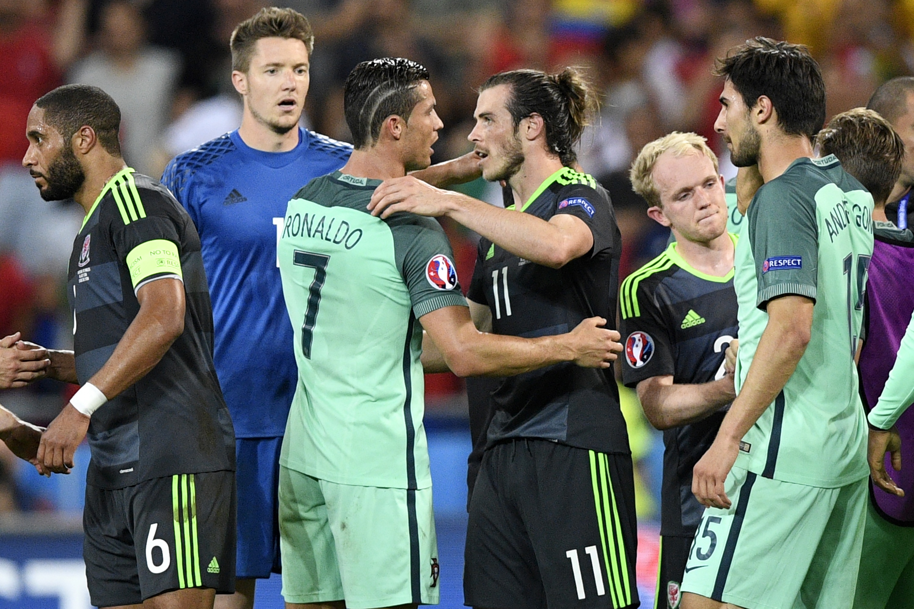 Portugal's forward Cristiano Ronaldo (L) embraces Wales' forward Gareth Bale after Portugal beat Wales 2-0 in the Euro 2016 semi-final football match between Portugal and Wales at the Parc Olympique Lyonnais stadium in Décines-Charpieu, near Lyon, on July 6, 2016.
 / AFP / MARTIN BUREAU        (Photo credit should read MARTIN BUREAU/AFP/Getty Images)