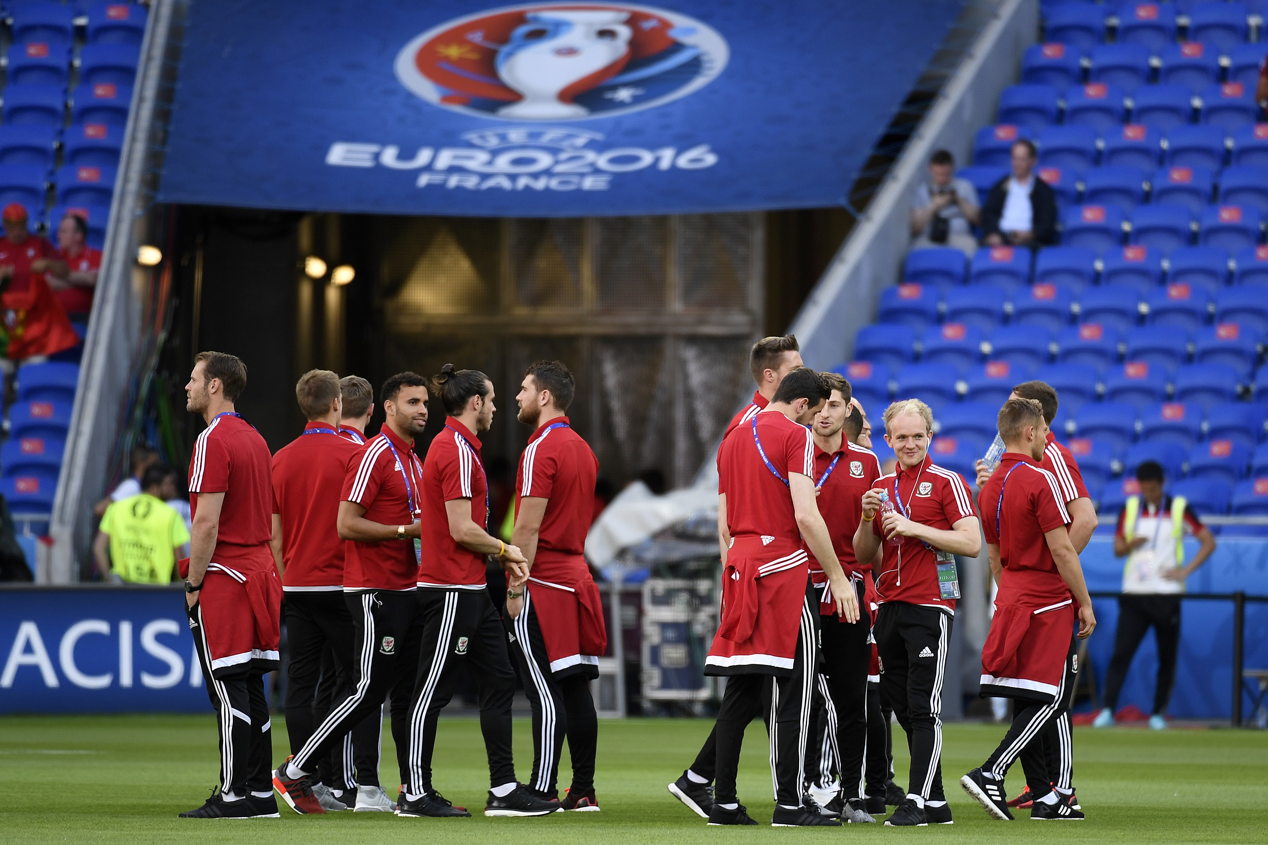 Wales teamates check the grounds prior to their upcoming match in the Euro 2016 semi-final football match between Portugal and Wales at the Parc Olympique Lyonnais stadium in Décines-Charpieu, near Lyon, on July 6, 2016.
 / AFP / PHILIPPE DESMAZES        (Photo credit should read PHILIPPE DESMAZES/AFP/Getty Images)
