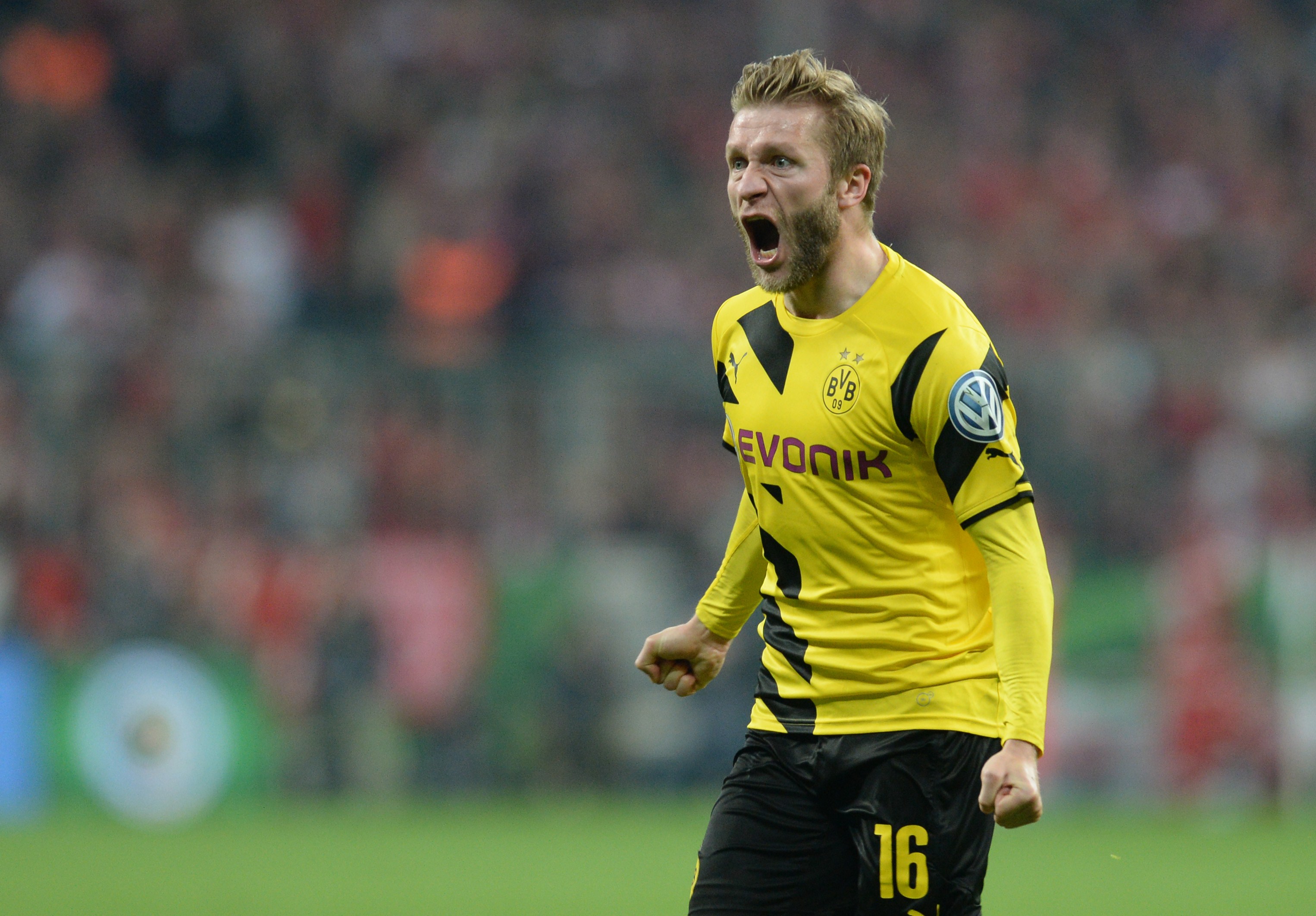 Dortmund's Polish midfielder Jakub Blaszczykowski celebrates the equalizer during the German Cup DFB Pokal semi-final football match FC Bayern Munich v Borussia Dortmund in Munich, southern Germany, on April 28, 2015.  AFP PHOTO / CHRISTOF STACHE

+++ RESTRICTIONS / EMBARGO  ACCORDING TO DFB RULES IMAGE SEQUENCES TO SIMULATE VIDEO IS NOT ALLOWED DURING MATCH TIME. MOBILE (MMS) USE IS NOT ALLOWED DURING AND FOR FURTHER TWO HOURS AFTER THE MATCH. FOR MORE INFORMATION CONTACT DFB DIRECTLY AT +49 69 67880        (Photo credit should read CHRISTOF STACHE/AFP/Getty Images)