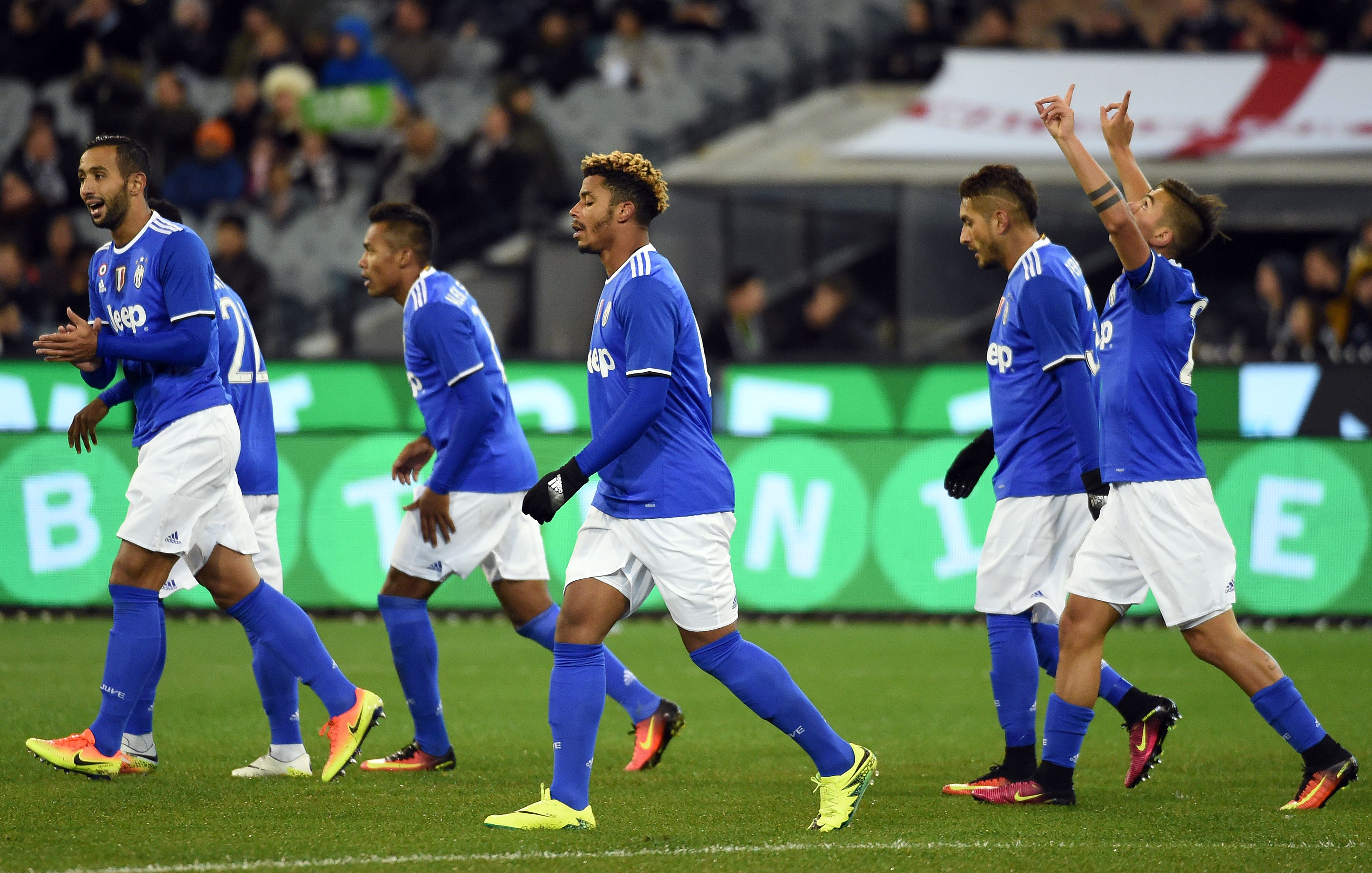 Juventus' players celebrate their first goal during the International Champions Cup football match between Italy's Serie A team Juventus and Premier League team Tottenham Hotspur in Melbourne on July 26, 2016.  / AFP / SAEED KHAN / IMAGE RESTRICTED TO EDITORIAL USE - STRICTLY NO COMMERCIAL USE        (Photo credit should read SAEED KHAN/AFP/Getty Images)