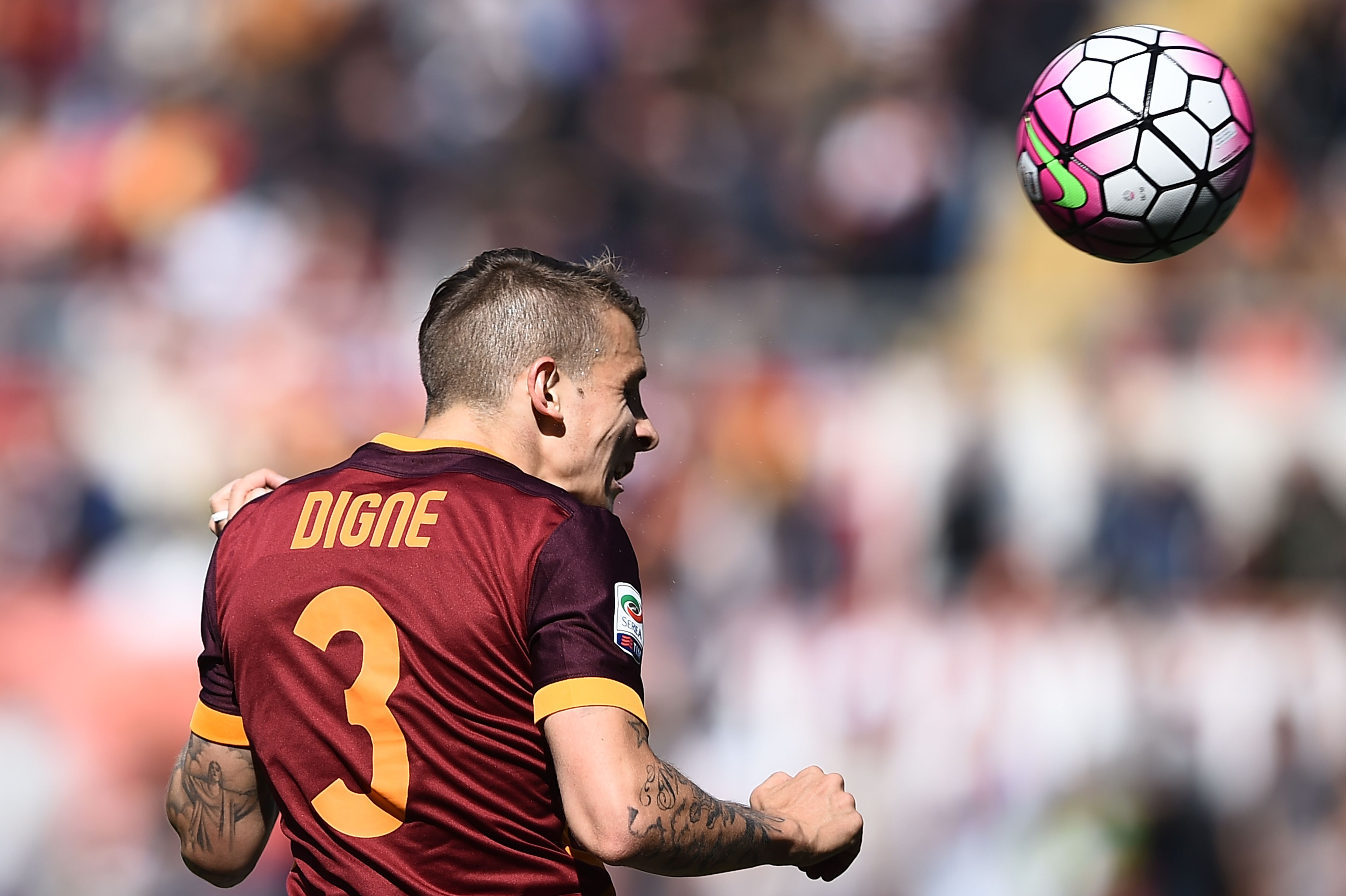 Roma's defender from France Lucas Digne heads the ball during the Italian Serie A football match AS Roma vs Napoli on April 25, 2016 at the Olympic Stadium in Rome.   AFP PHOTO / FILIPPO MONTEFORTE / AFP / FILIPPO MONTEFORTE        (Photo credit should read FILIPPO MONTEFORTE/AFP/Getty Images)