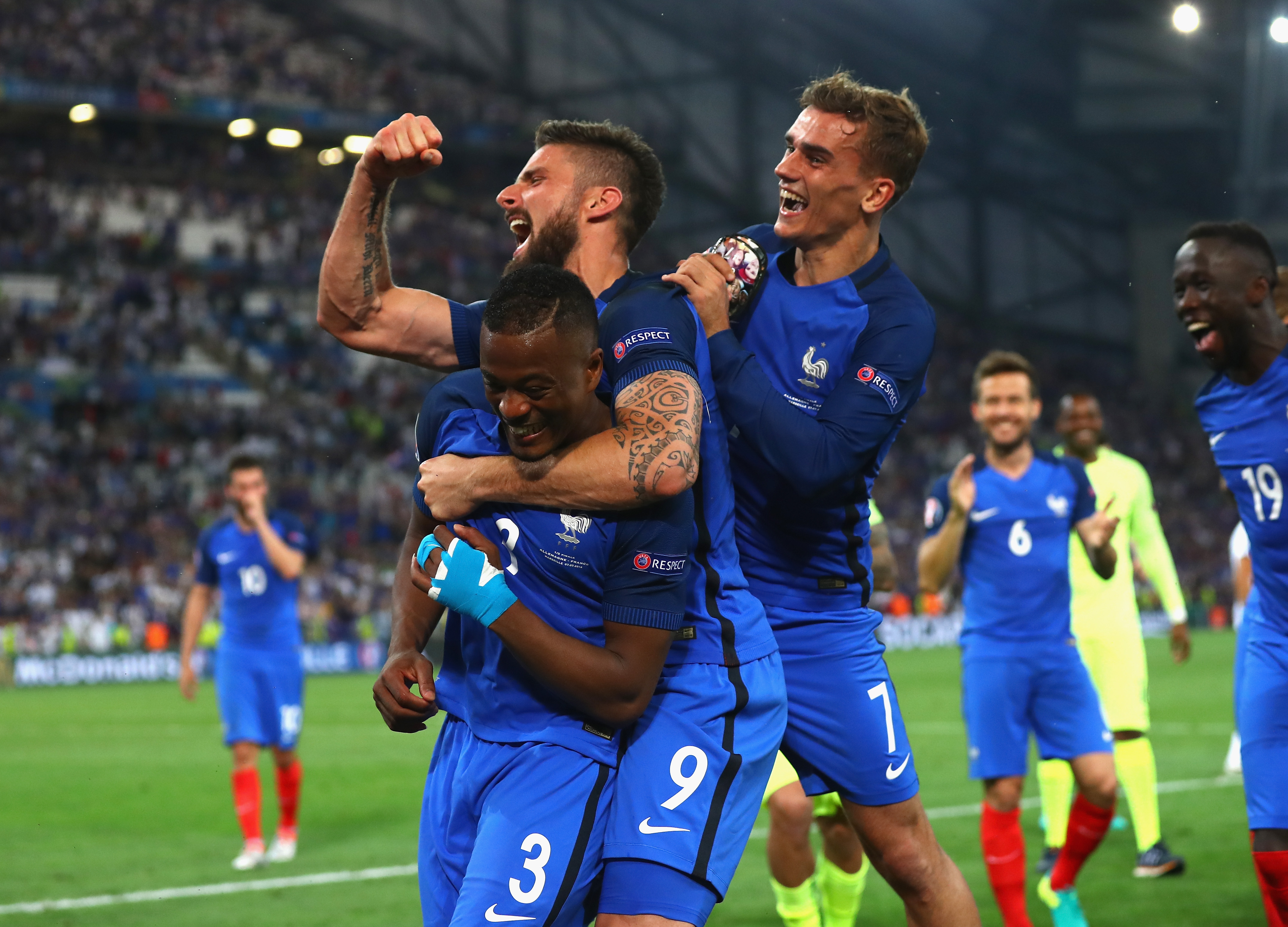 MARSEILLE, FRANCE - JULY 07:  (L to R) Patrice Evra, Olivier Giroud and Antoine Griezmannof France celebrate their team's 2-0 win in the UEFA EURO semi final match between Germany and France at Stade Velodrome on July 7, 2016 in Marseille, France.  (Photo by Lars Baron/Getty Images)