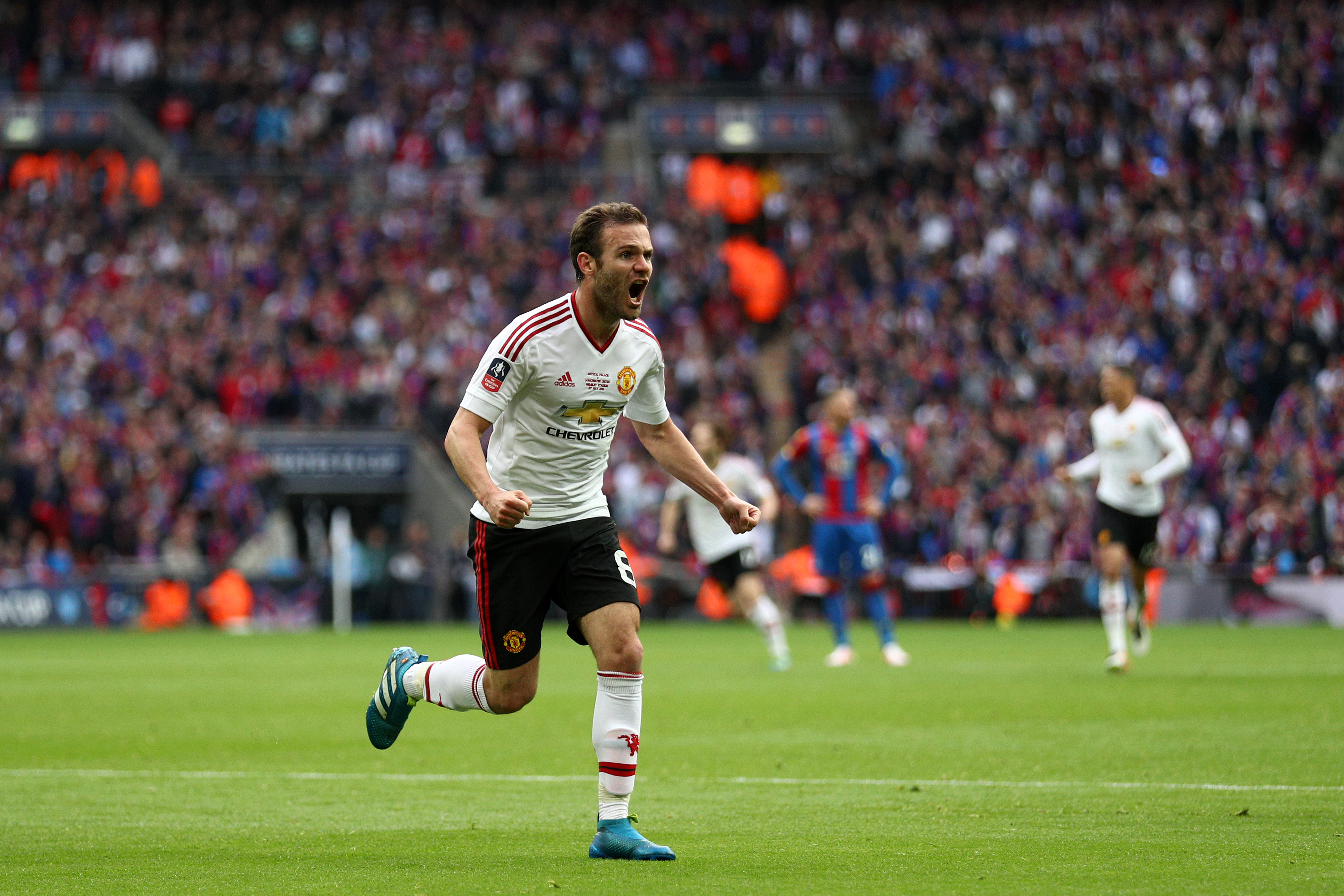LONDON, ENGLAND - MAY 21:  Juan Mata of Manchester United (L) celebrates as he scores their first goal during The Emirates FA Cup Final match between Manchester United and Crystal Palace at Wembley Stadium on May 21, 2016 in London, England.  (Photo by Paul Gilham/Getty Images)