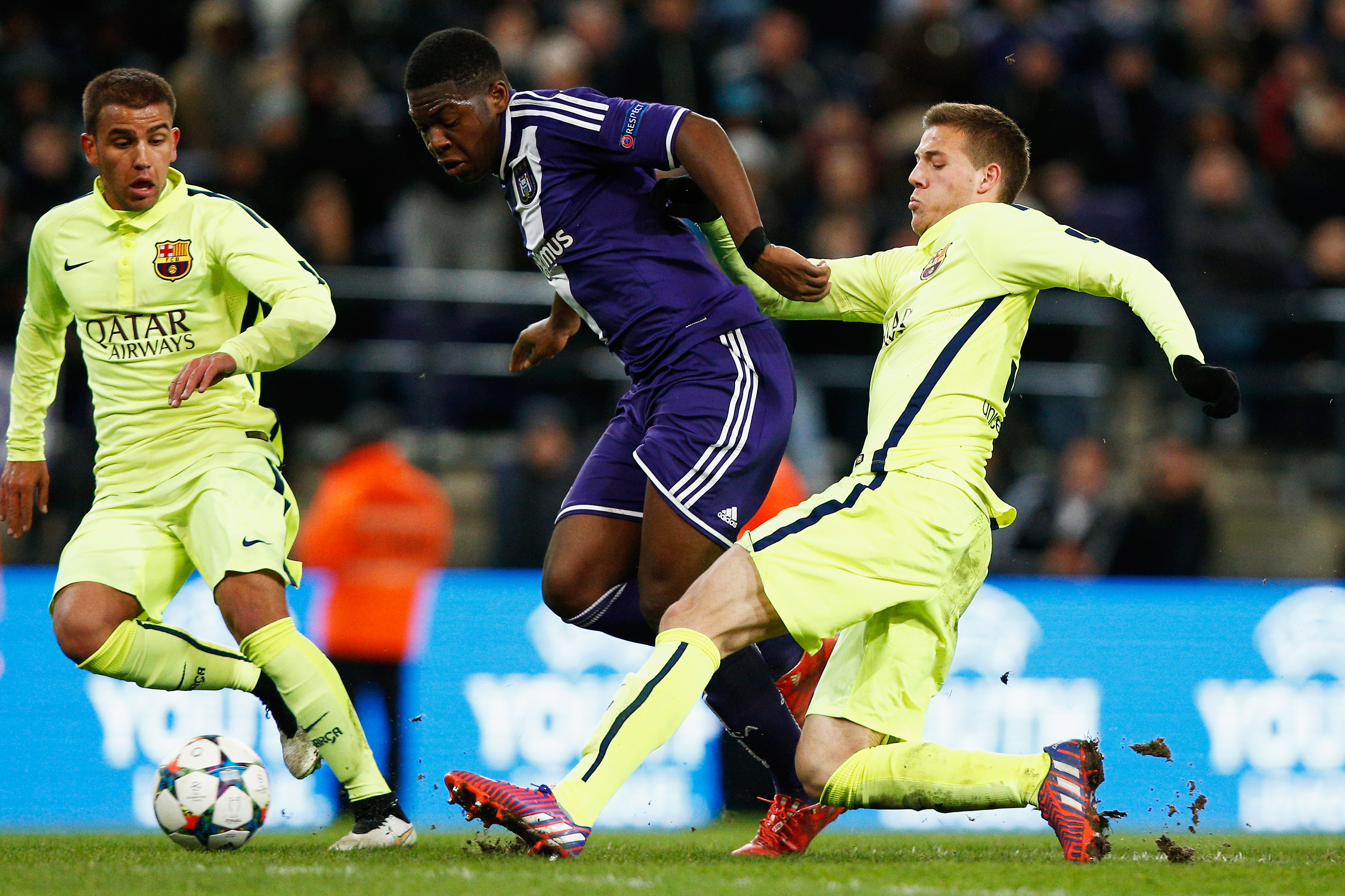BRUSSELS, BELGIUM - FEBRUARY 23:  Aaron Leya Iseka of Anderlecht is tackled by Juanma Garcia (L) and Rodri Tarin (R) of Barcelona during the UEFA Youth League Round of 16 match between RSC Anderlecht and FC Barcelona held at Constant Vanden Stock Stadium on February 23, 2015 in Brussels, Belgium.  (Photo by Dean Mouhtaropoulos/Getty Images)