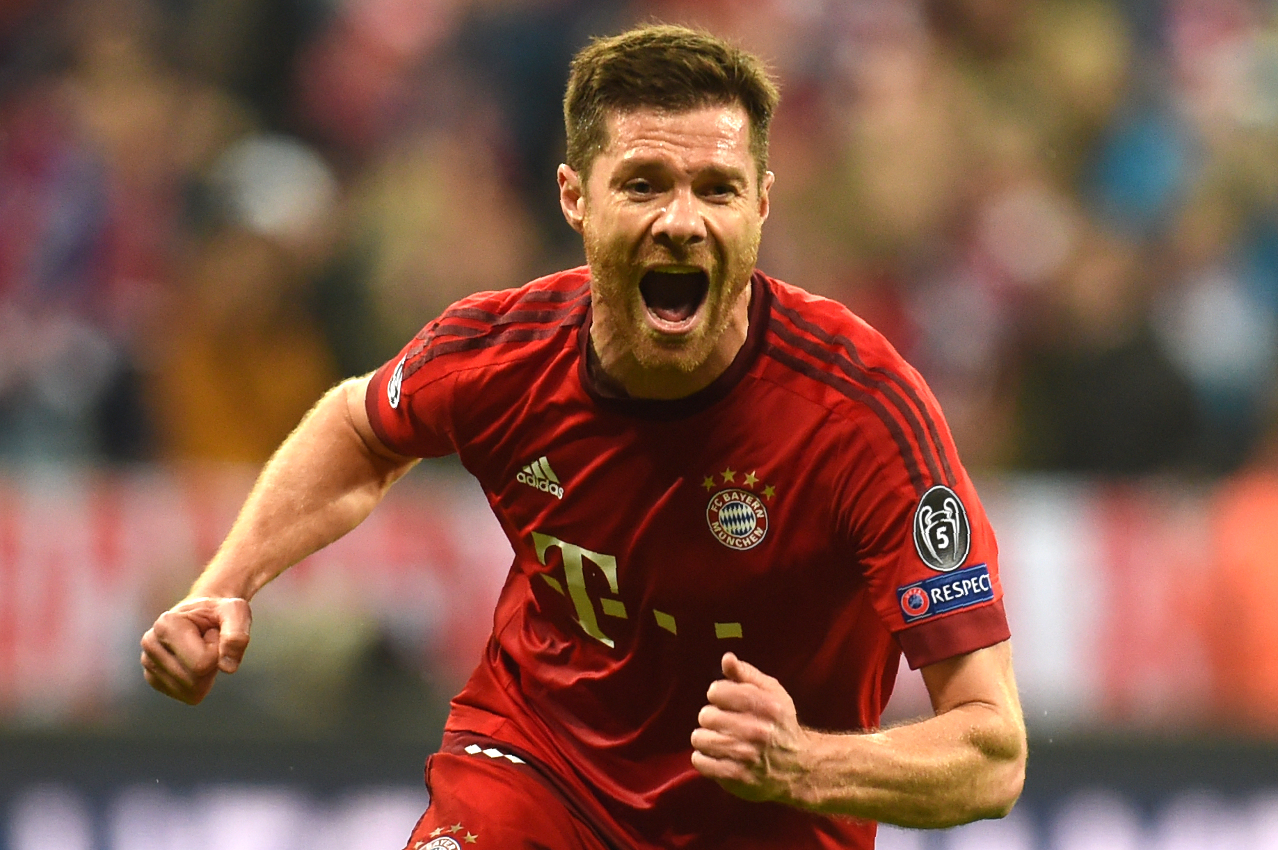 TOPSHOT - Bayern Munich's Spanish midfielder Xabi Alonso celebrates scoring during the UEFA Champions League semi-final, second-leg football match between FC Bayern Munich and Atletico Madrid in Munich, southern Germany, on May 3, 2016. / AFP / Christof Stache        (Photo credit should read CHRISTOF STACHE/AFP/Getty Images)