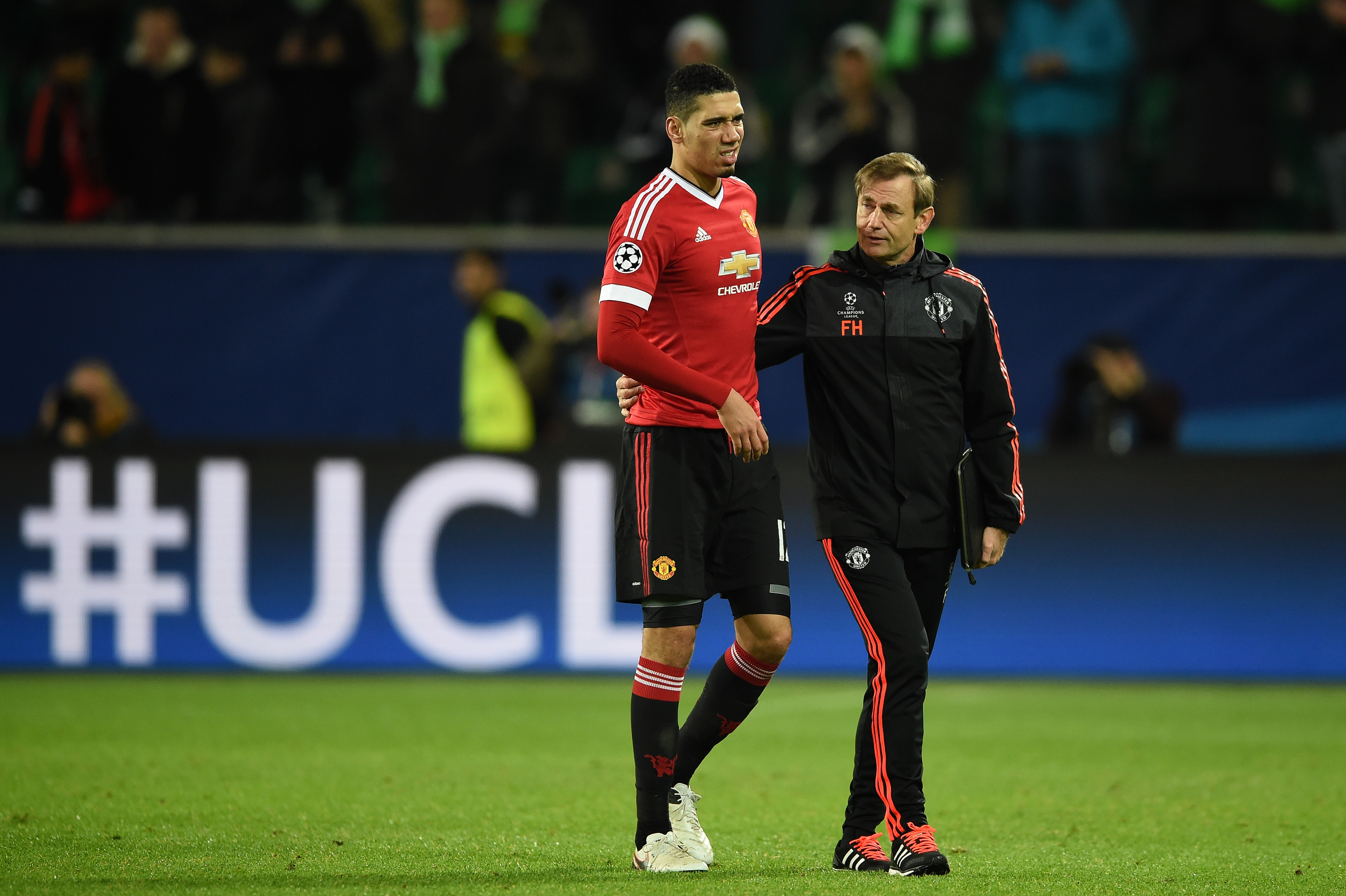 WOLFSBURG, GERMANY - DECEMBER 08:  A dejected Chris Smalling the captain of Manchester United walks off the pitch following hjis team's 3-2 defeat and exit from the competition during the UEFA Champions League group B match between VfL Wolfsburg and Manchester United at the Volkswagen Arena on December 8, 2015 in Wolfsburg, Germany.  (Photo by Stuart Franklin/Bongarts/Getty Images)