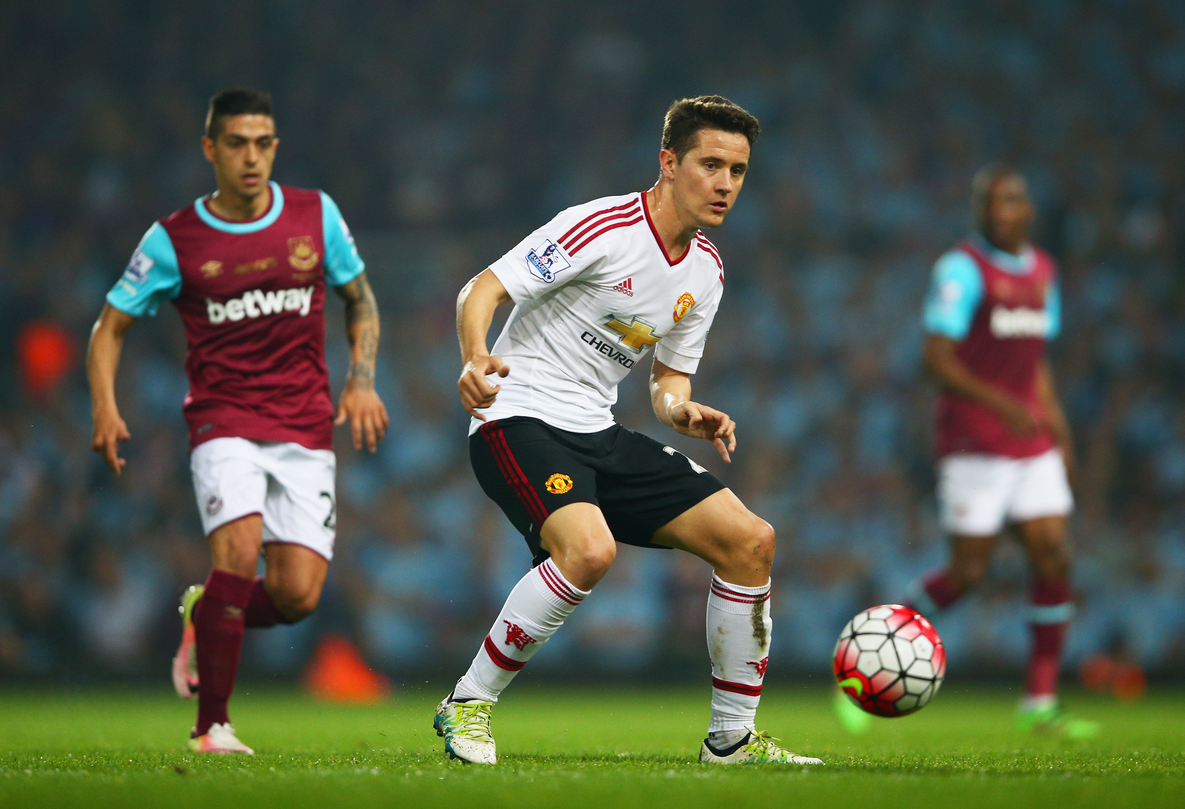 LONDON, UNITED KINGDOM - MAY 10:  Ander Herrera of Manchester United is watched by Manuel Lanzini of West Ham United during the Barclays Premier League match between West Ham United and Manchester United at the Boleyn Ground on May 10, 2016 in London, England. West Ham United are playing their last ever home match at the Boleyn Ground after their 112 year stay at the stadium. The Hammers will move to the Olympic Stadium for the 2016-17 season.  (Photo by Paul Gilham/Getty Images)