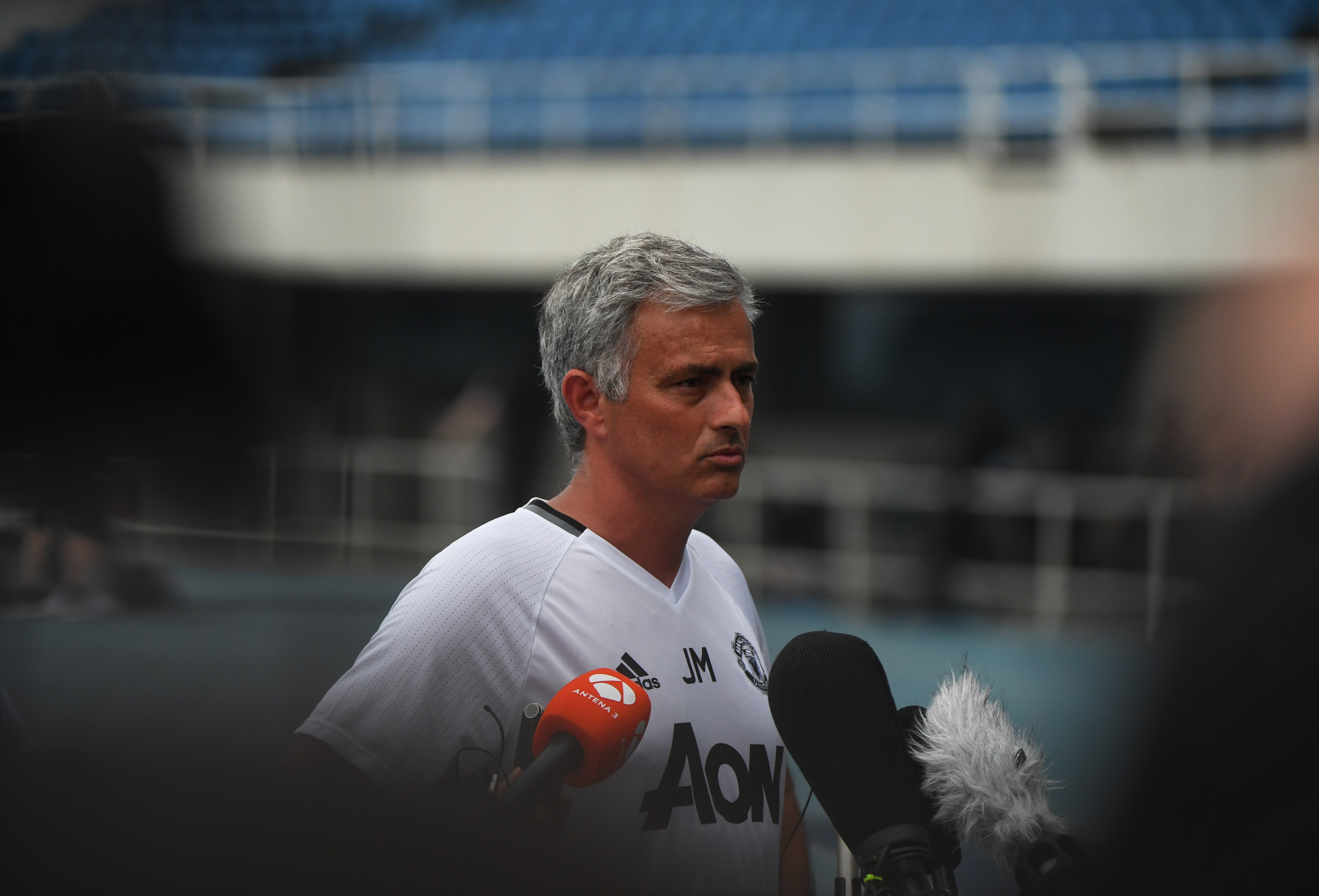 Manchester United coach Jose Mourinho speaks to media before a training session a day before the 2016 International Champions Cup football match between Manchester City and Manchester United, in Beijing on July 24, 2016. / AFP / GREG BAKER        (Photo credit should read GREG BAKER/AFP/Getty Images)