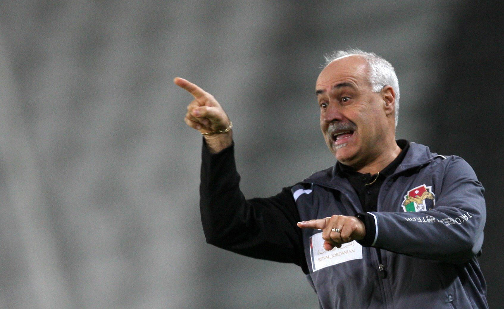 Jordan's national team coach Nelo Vingada of Purtugal gestures during his team's friendly football match against Qatar in Doha on March 16, 2008. Qatar won the match 2-1. AFP PHOTO/KARIM JAAFAR (Photo credit should read KARIM JAAFAR/AFP/Getty Images)