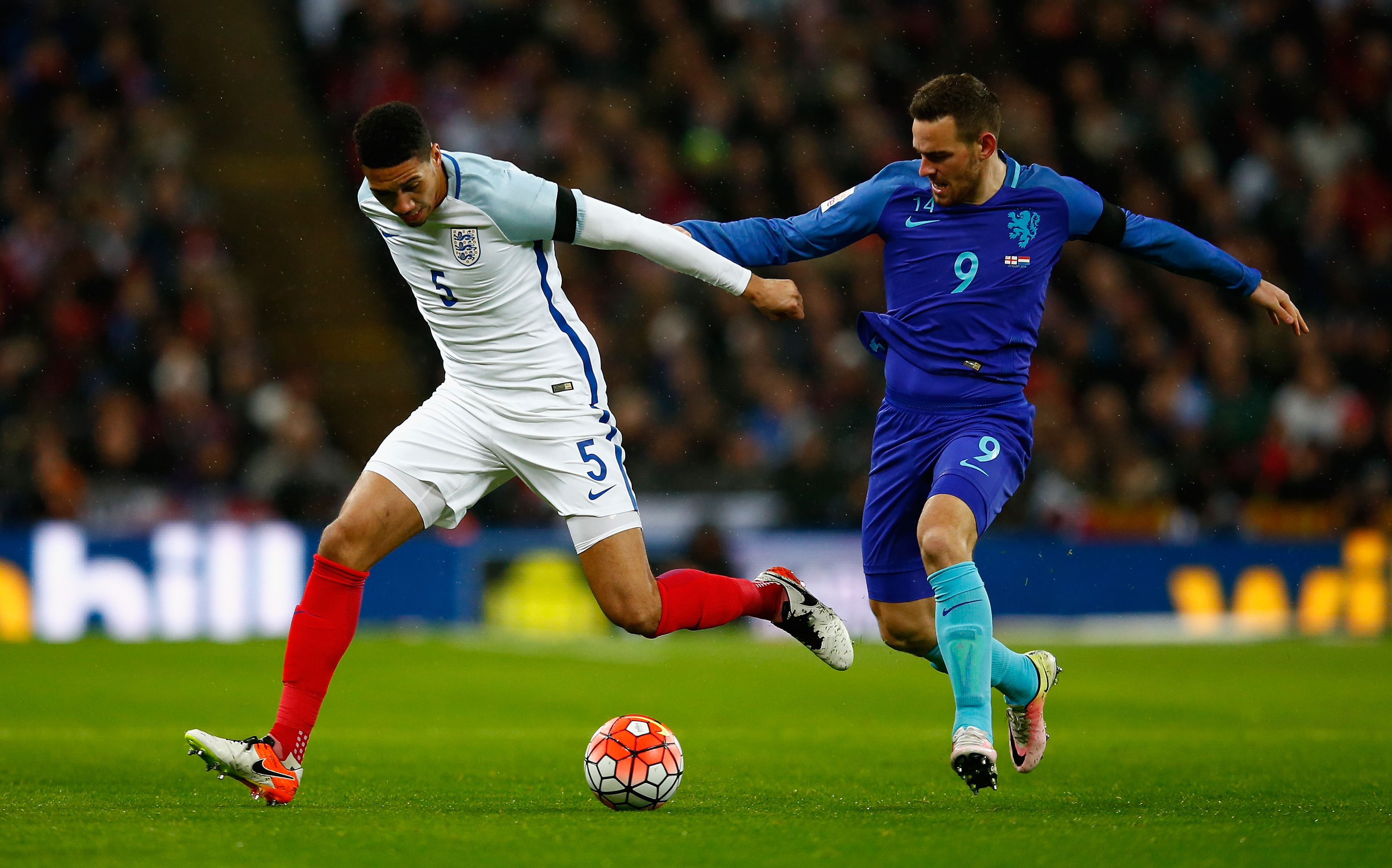 LONDON, ENGLAND - MARCH 29:  Chris Smalling of England and Vincent Janssen of the Netherlands battle for the ball during the International Friendly match between England and Netherlands at Wembley Stadium on March 29, 2016 in London, England.  (Photo by Julian Finney/Getty Images)