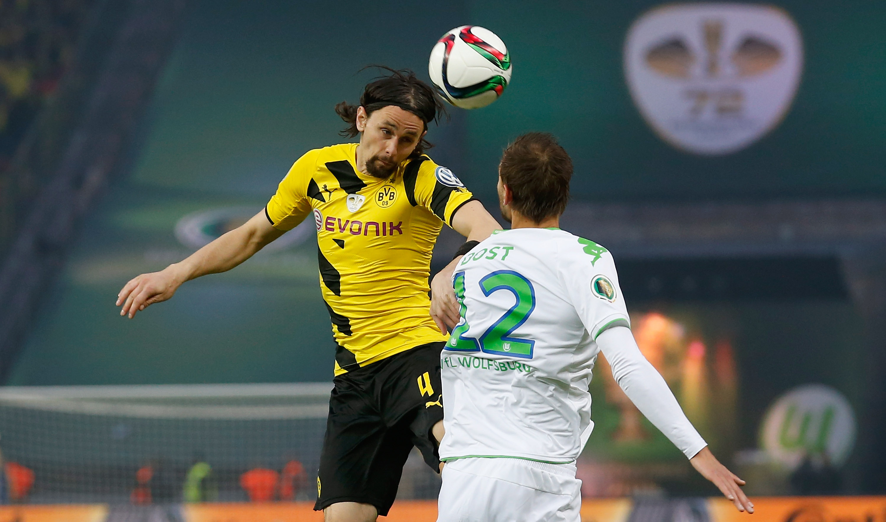 BERLIN, GERMANY - MAY 30:  Neven Subotic (L) of Dortmund jumps for a header with Bas Dost of Wolfsburg during the DFB Cup Final match between Borussia Dortmund and VfL Wolfsburg at Olympiastadion on May 30, 2015 in Berlin, Germany.  (Photo by Boris Streubel/Bongarts/Getty Images)