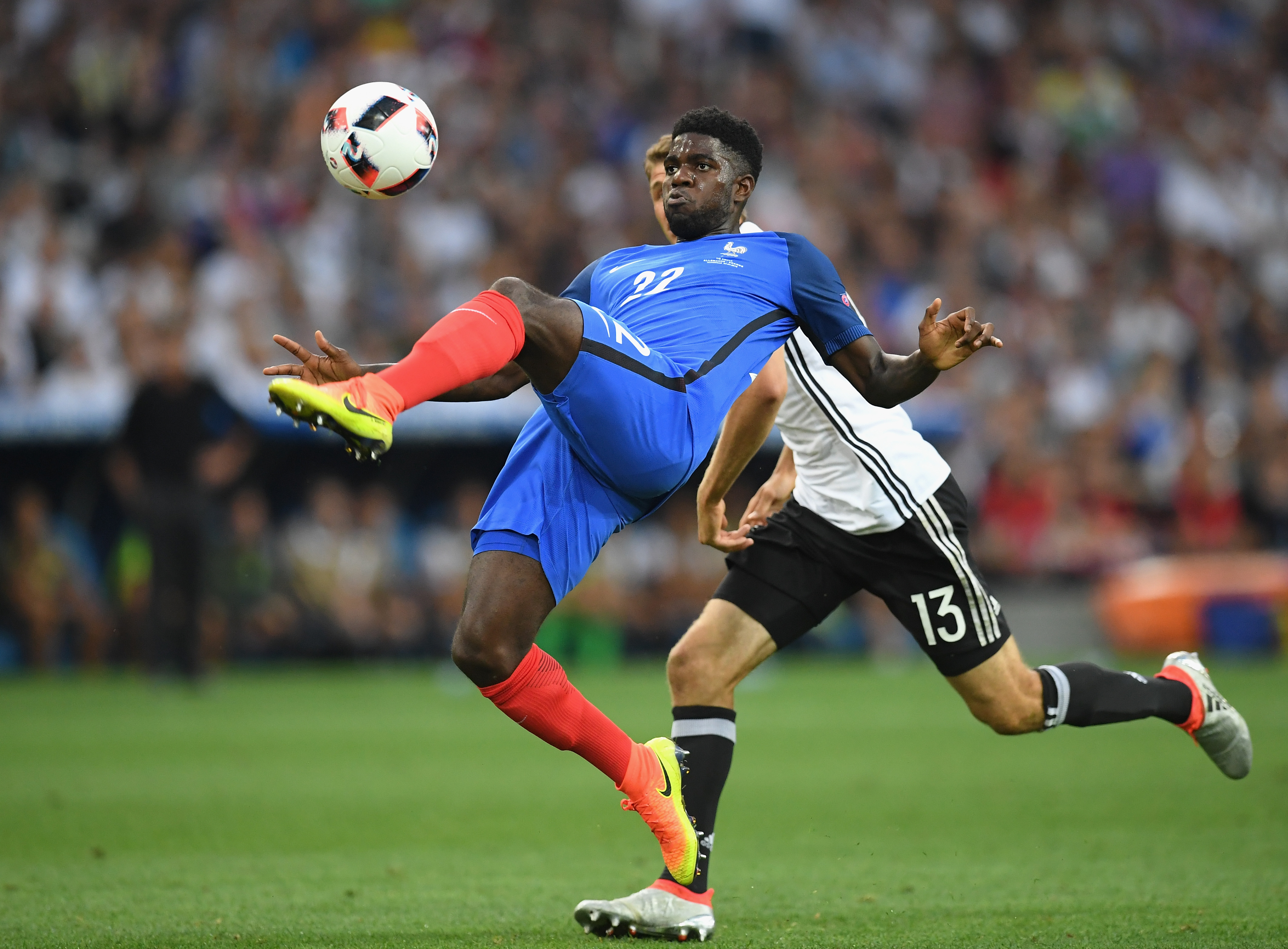 MARSEILLE, FRANCE - JULY 07:  Samuel Umtiti of France clears the ball under pressure from Thomas Mueller of Germany during the UEFA EURO semi final match between Germany and France at Stade Velodrome on July 7, 2016 in Marseille, France.  (Photo by Matthias Hangst/Getty Images)